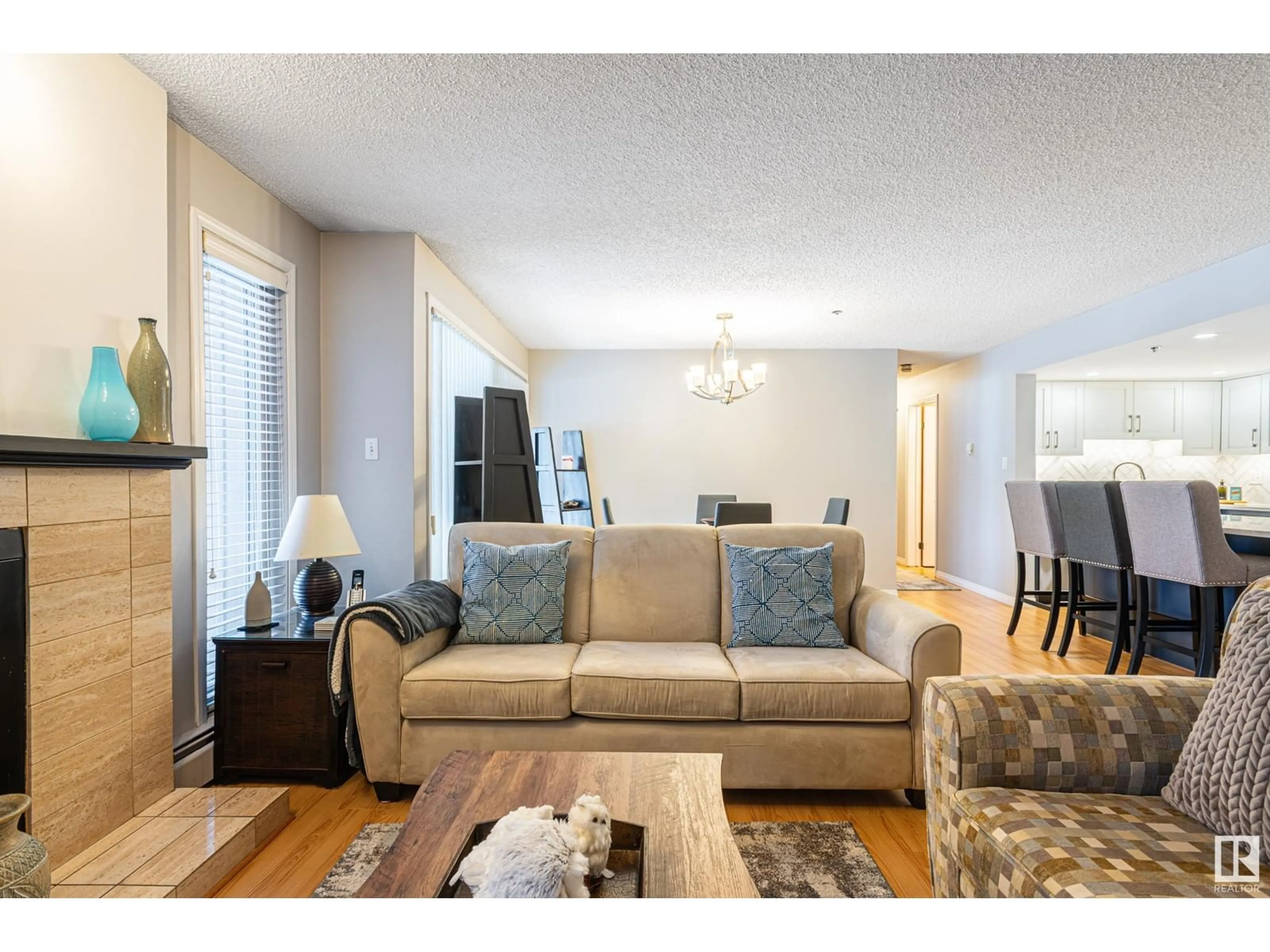 Living room with furniture, wood/laminate floor for #201 10171 119 ST NW, Edmonton Alberta T5K1Z1