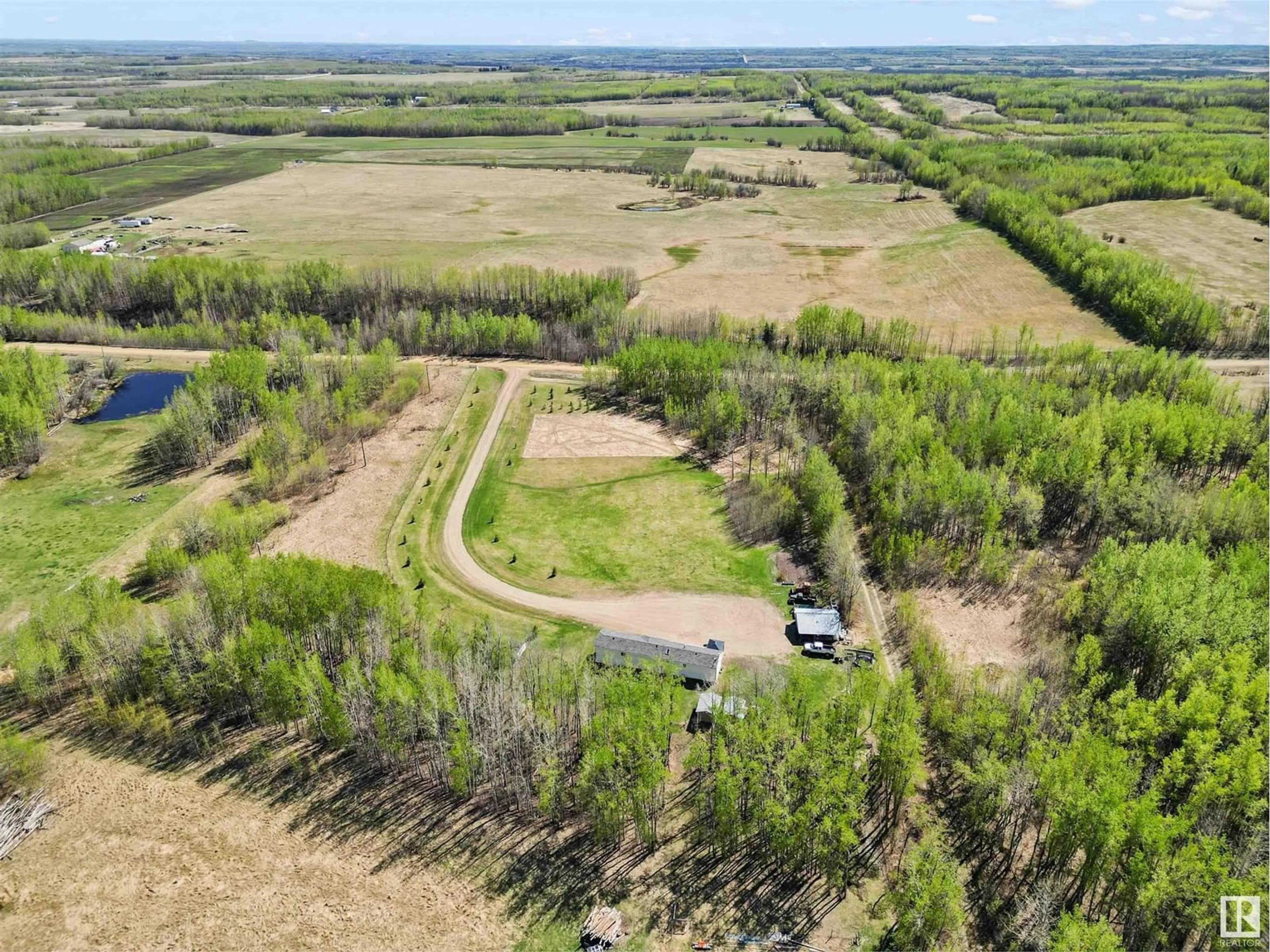 A pic from outside/outdoor area/front of a property/back of a property/a pic from drone, forest/trees view for 7418 TWP RD 510, Rural Parkland County Alberta T0C1Z0