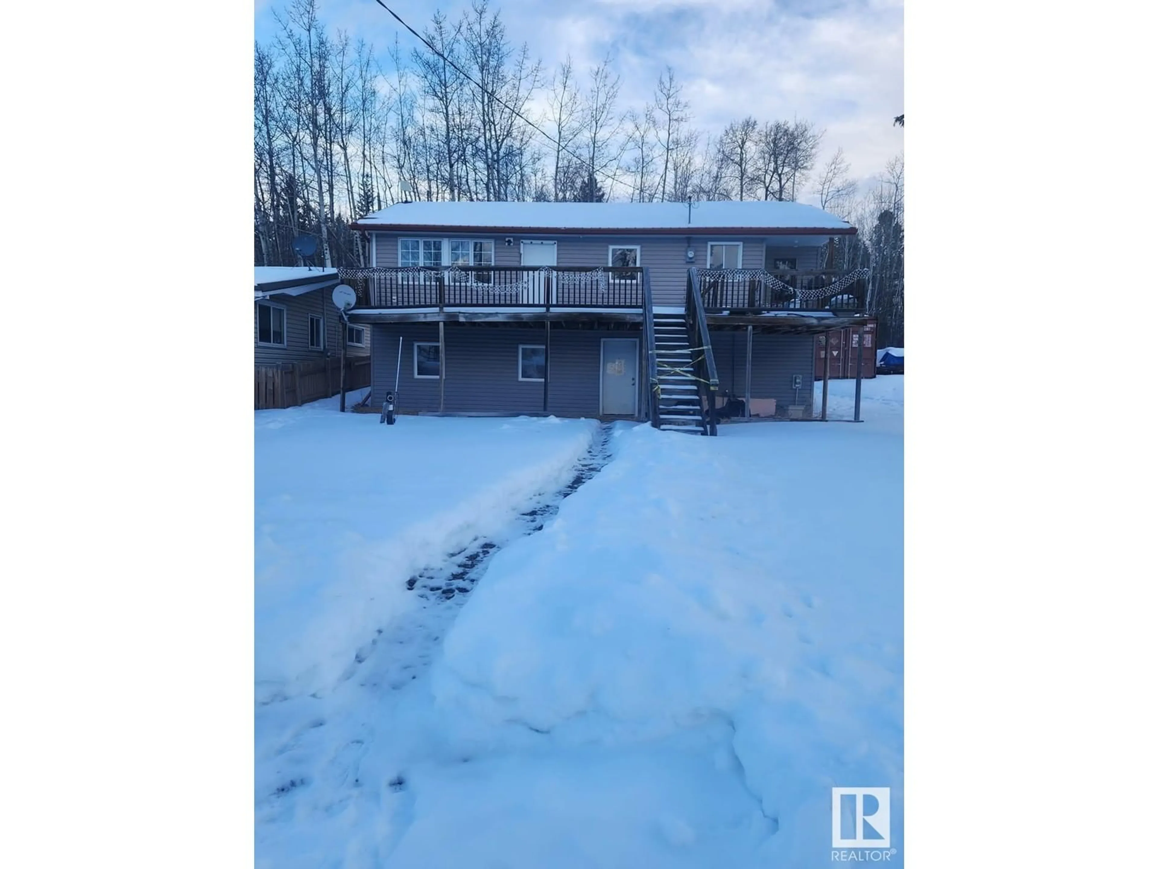 A pic from outside/outdoor area/front of a property/back of a property/a pic from drone, water/lake/river/ocean view for 9914 101 AV, Rural Lac Ste. Anne County Alberta T0E0L0