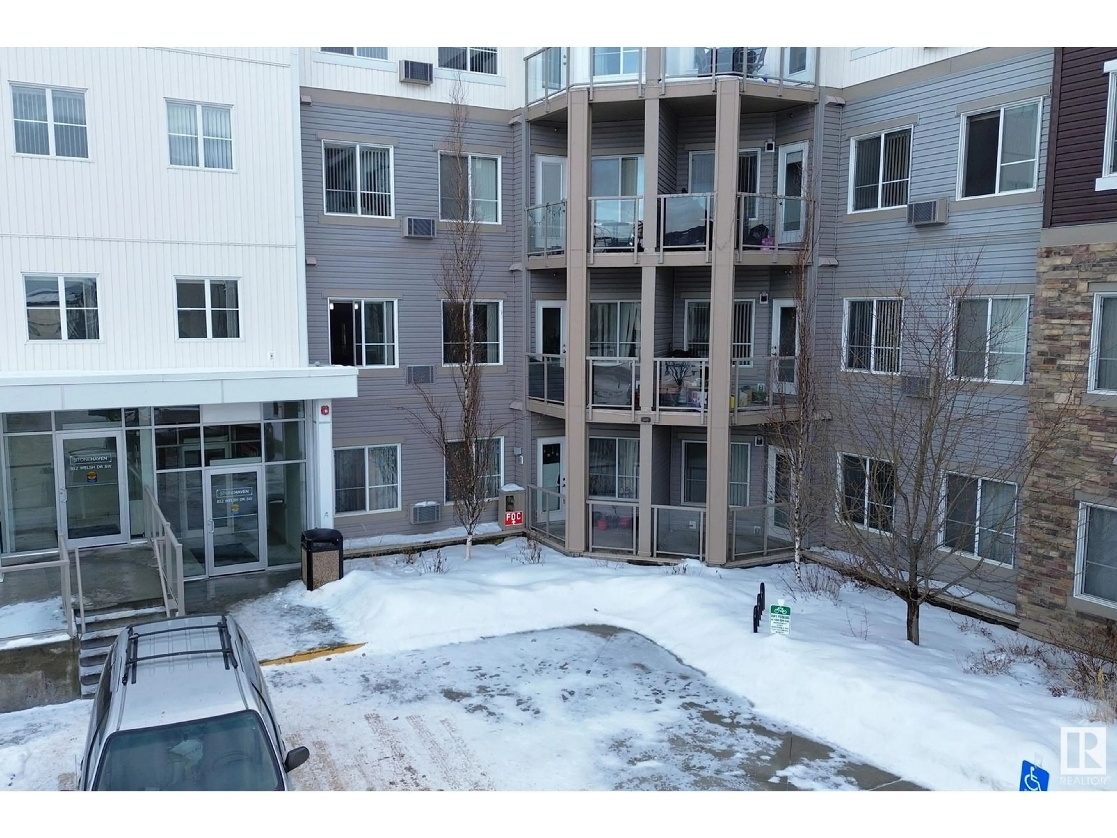 A pic from outside/outdoor area/front of a property/back of a property/a pic from drone, building for #214 812 WELSH DR SW, Edmonton Alberta T6X1Y7