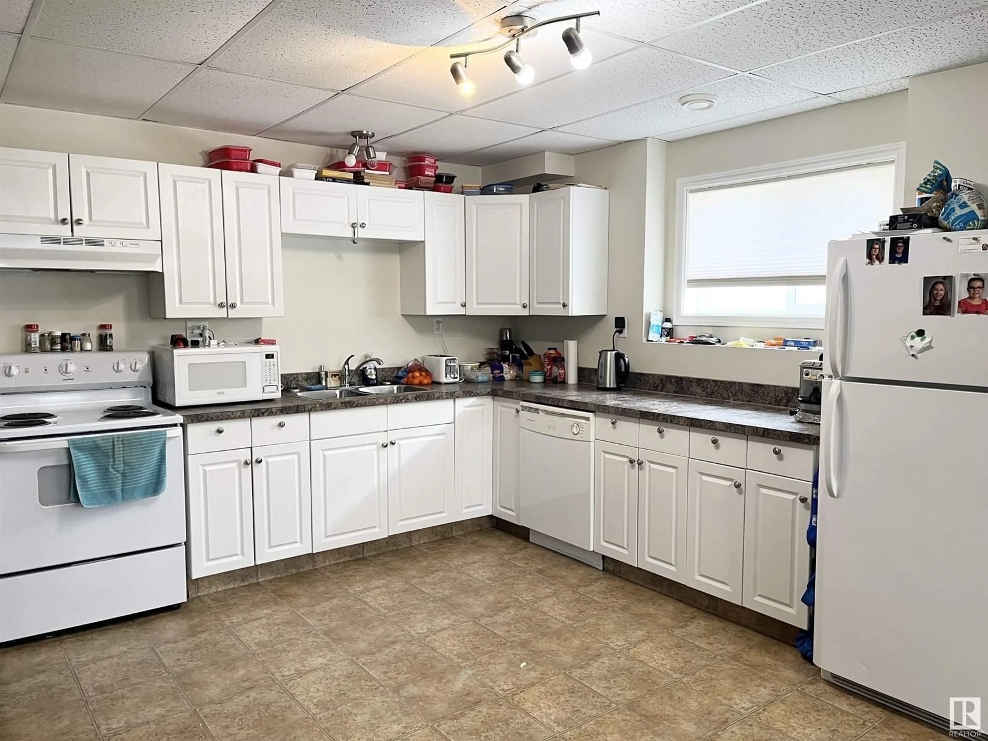 Standard kitchen, ceramic/tile floor for #102 3904 47 AV, Bonnyville Town Alberta T9N0A3