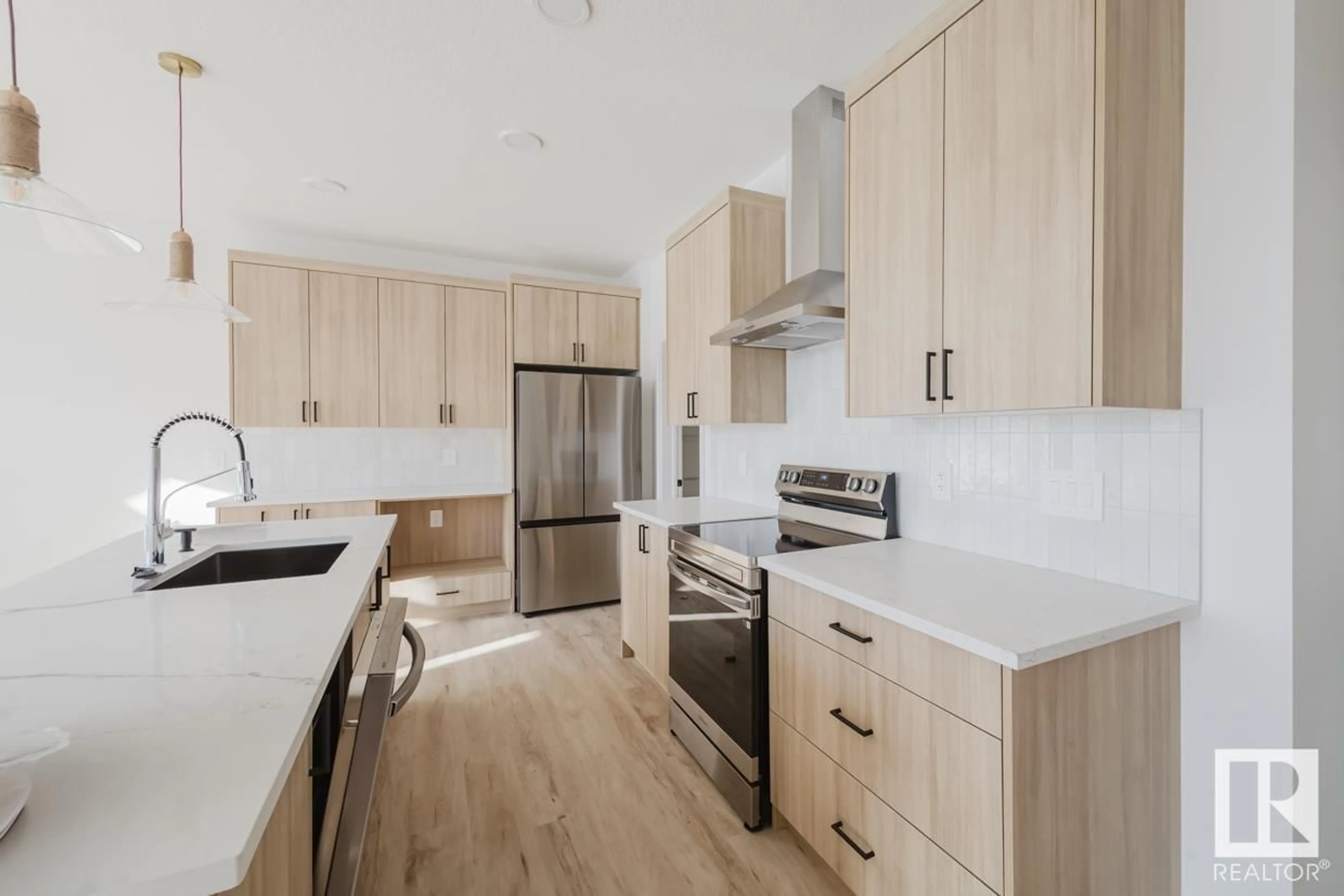 Open concept kitchen, wood/laminate floor for NW - 4227 206 ST, Edmonton Alberta T6M3E3