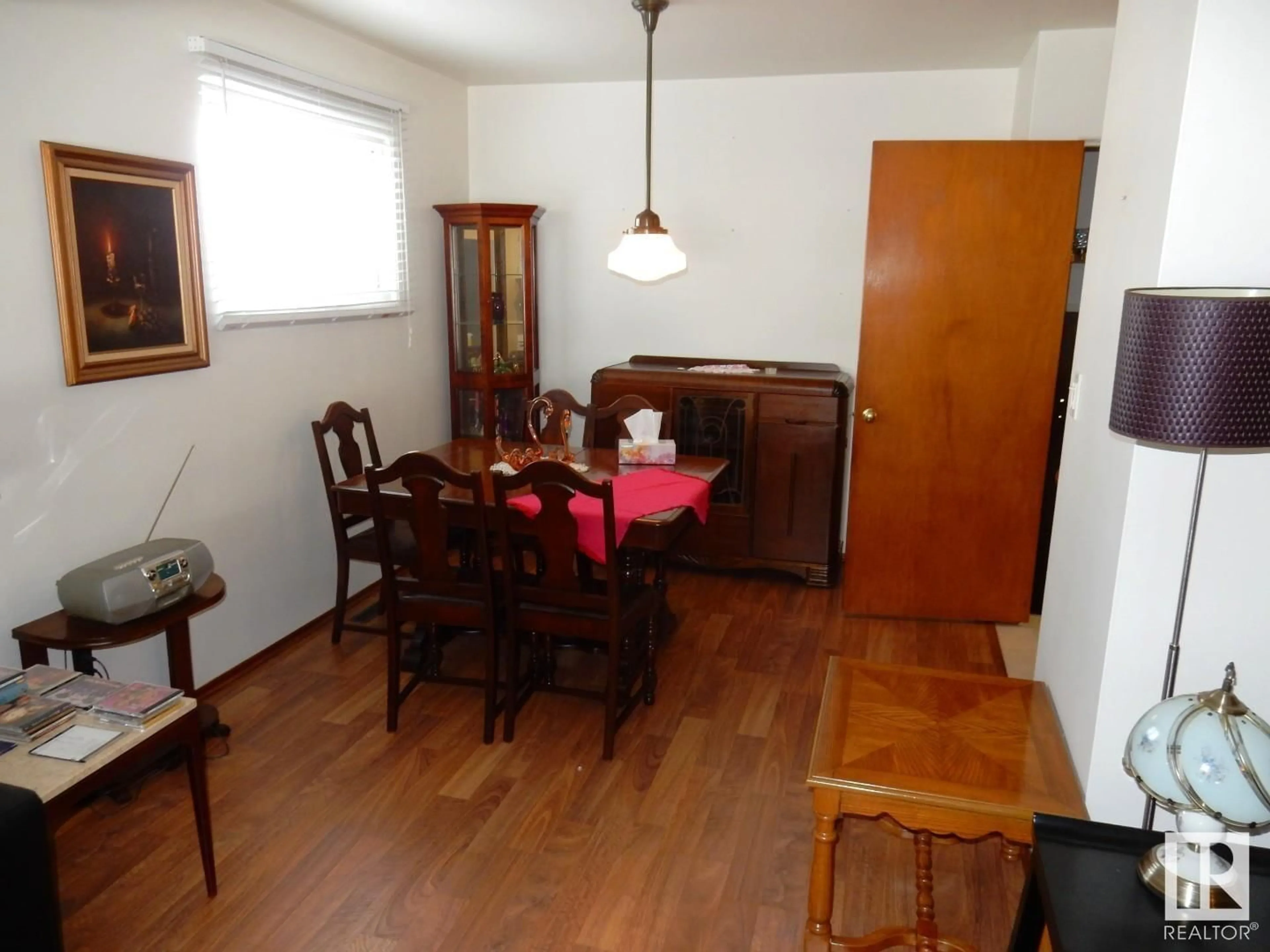 Dining room, wood/laminate floor for 10407 50 ST NW, Edmonton Alberta T6A2C3