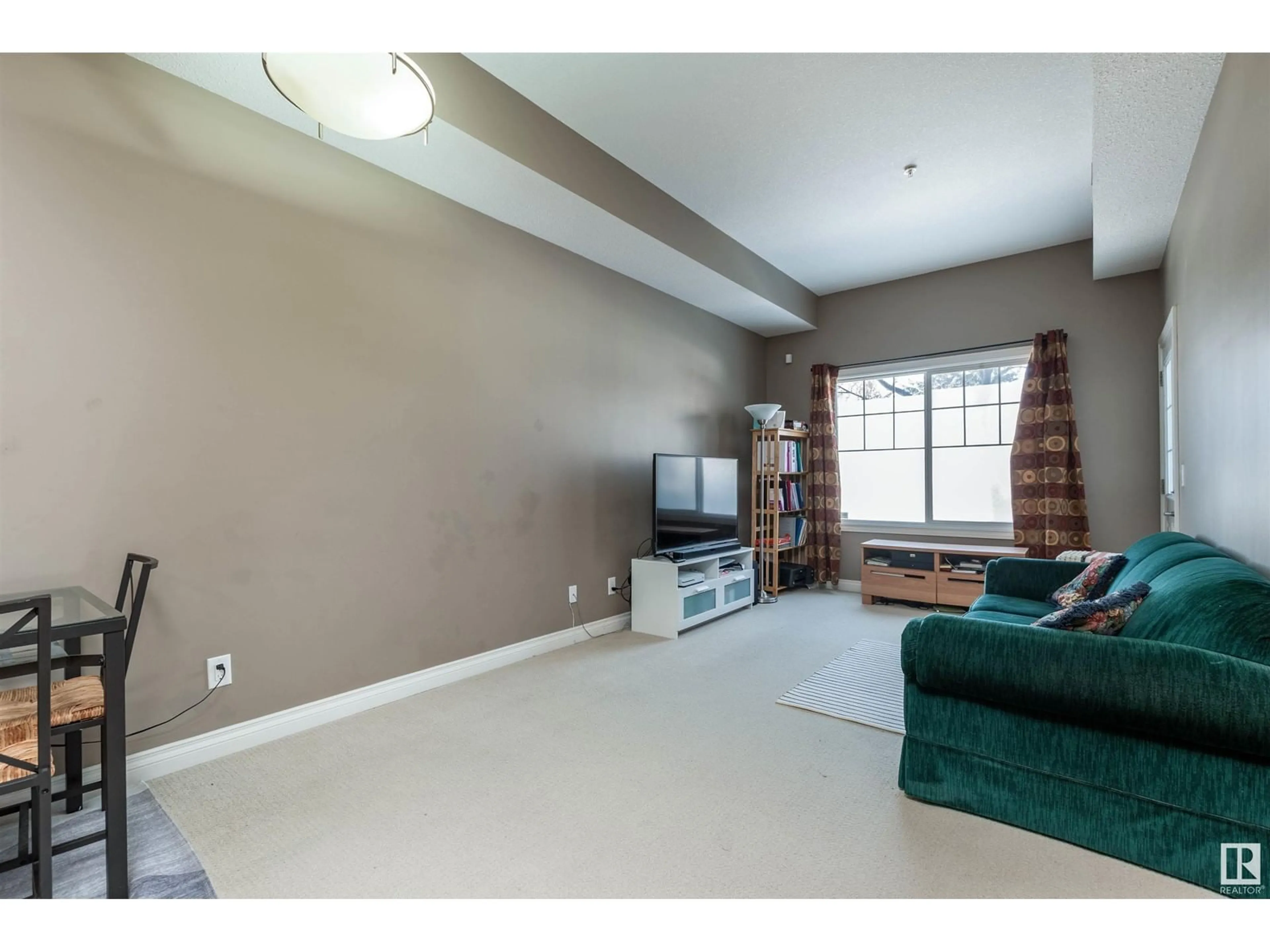 Living room with furniture, unknown for #103 6720 112 ST NW, Edmonton Alberta T6H3J8