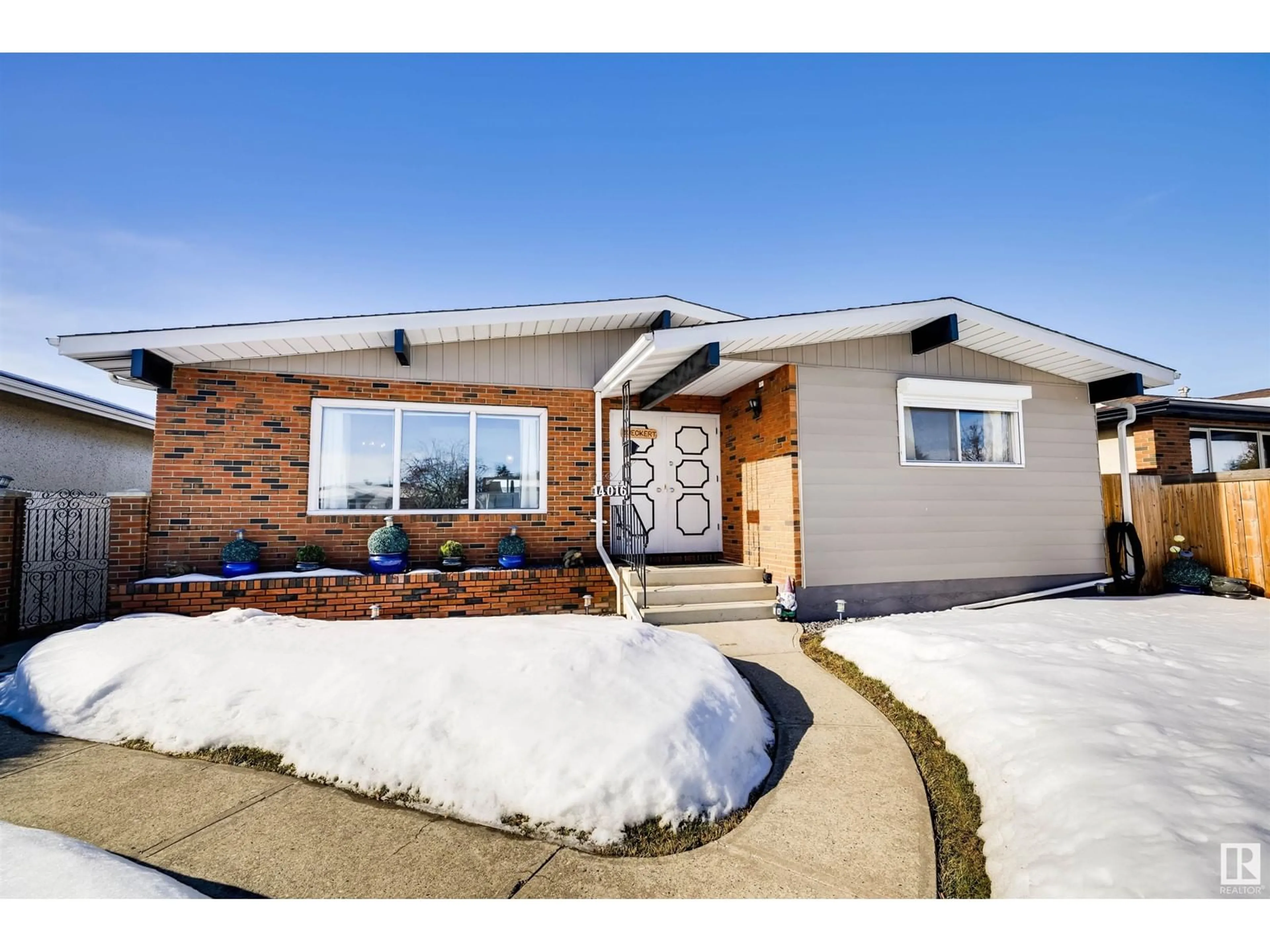 Home with brick exterior material, street for 14016 95A ST NW, Edmonton Alberta T5E5Z4