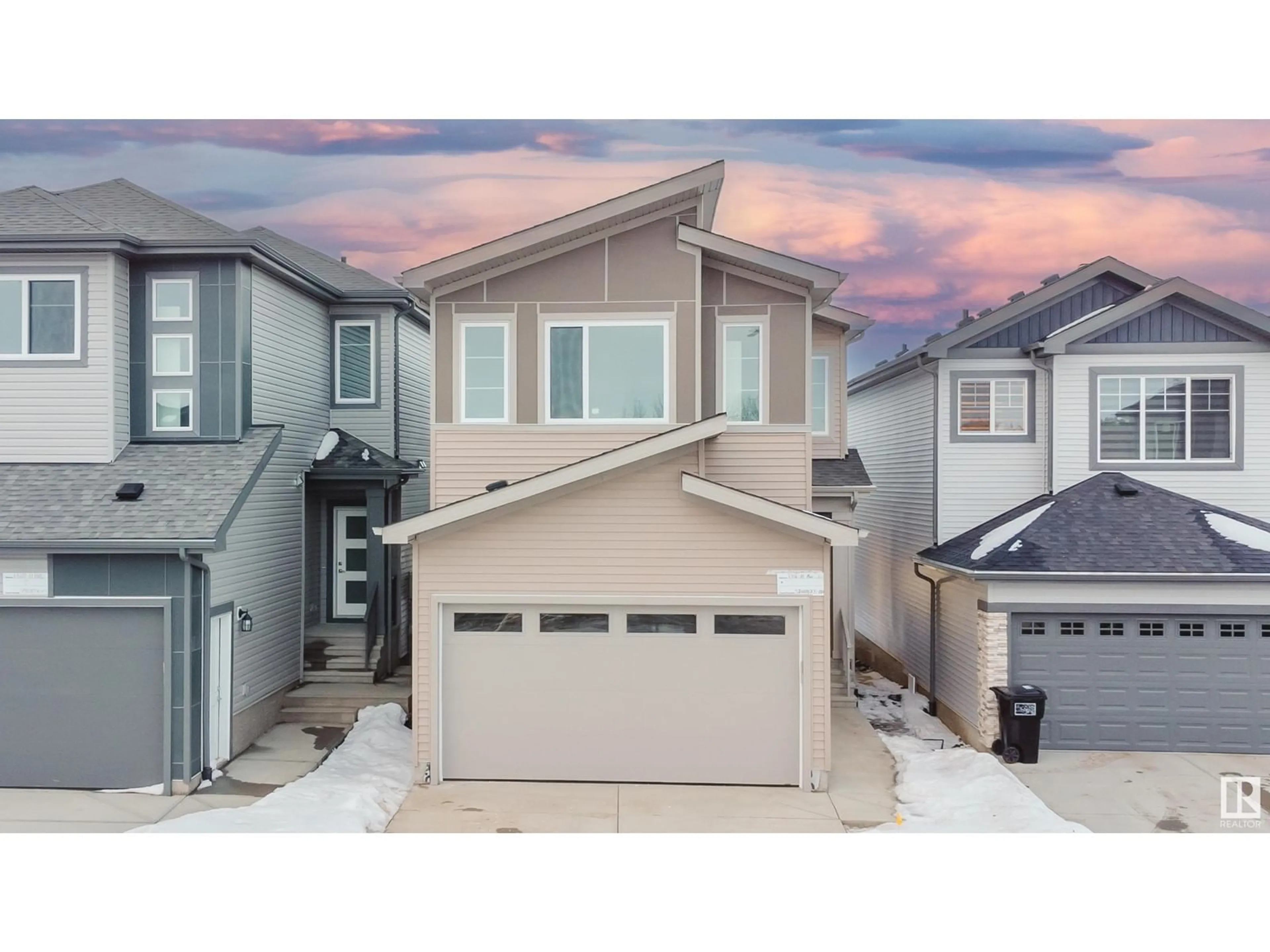 Home with vinyl exterior material, street for 1316 11 AV NW, Edmonton Alberta T6T2W3