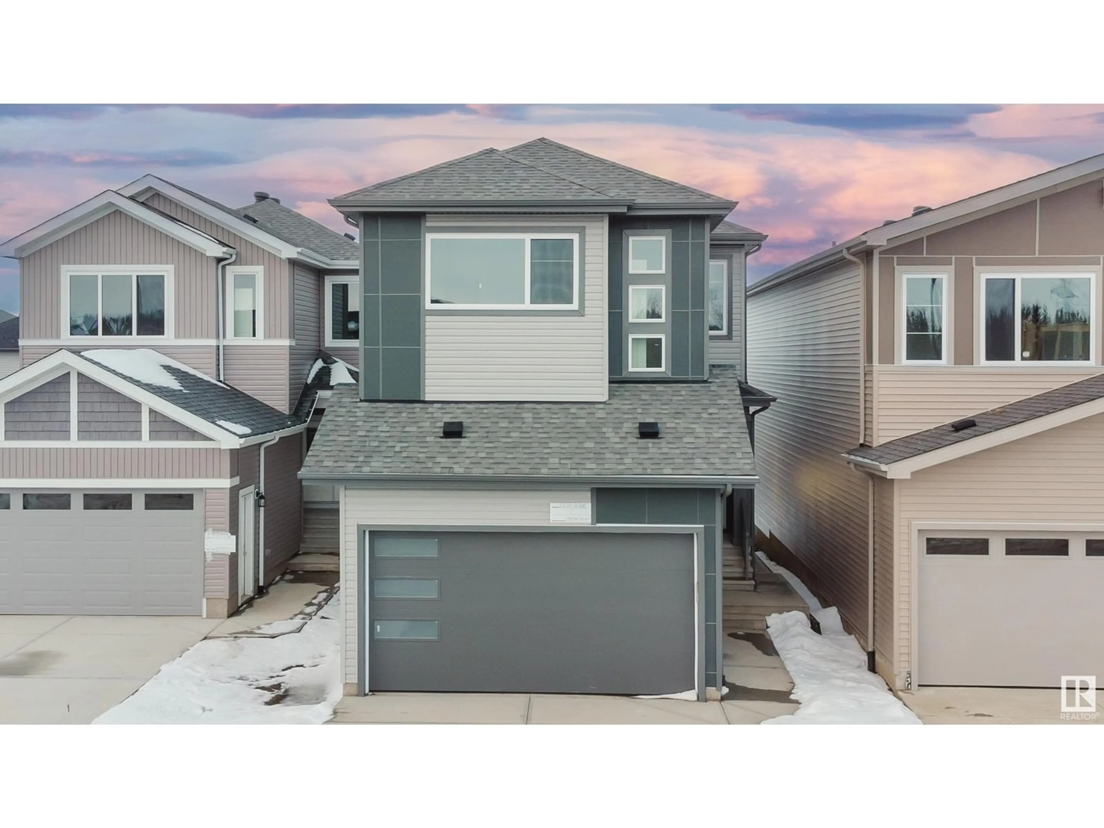 Home with vinyl exterior material, street for 1320 11 AV NW, Edmonton Alberta T6T2W3