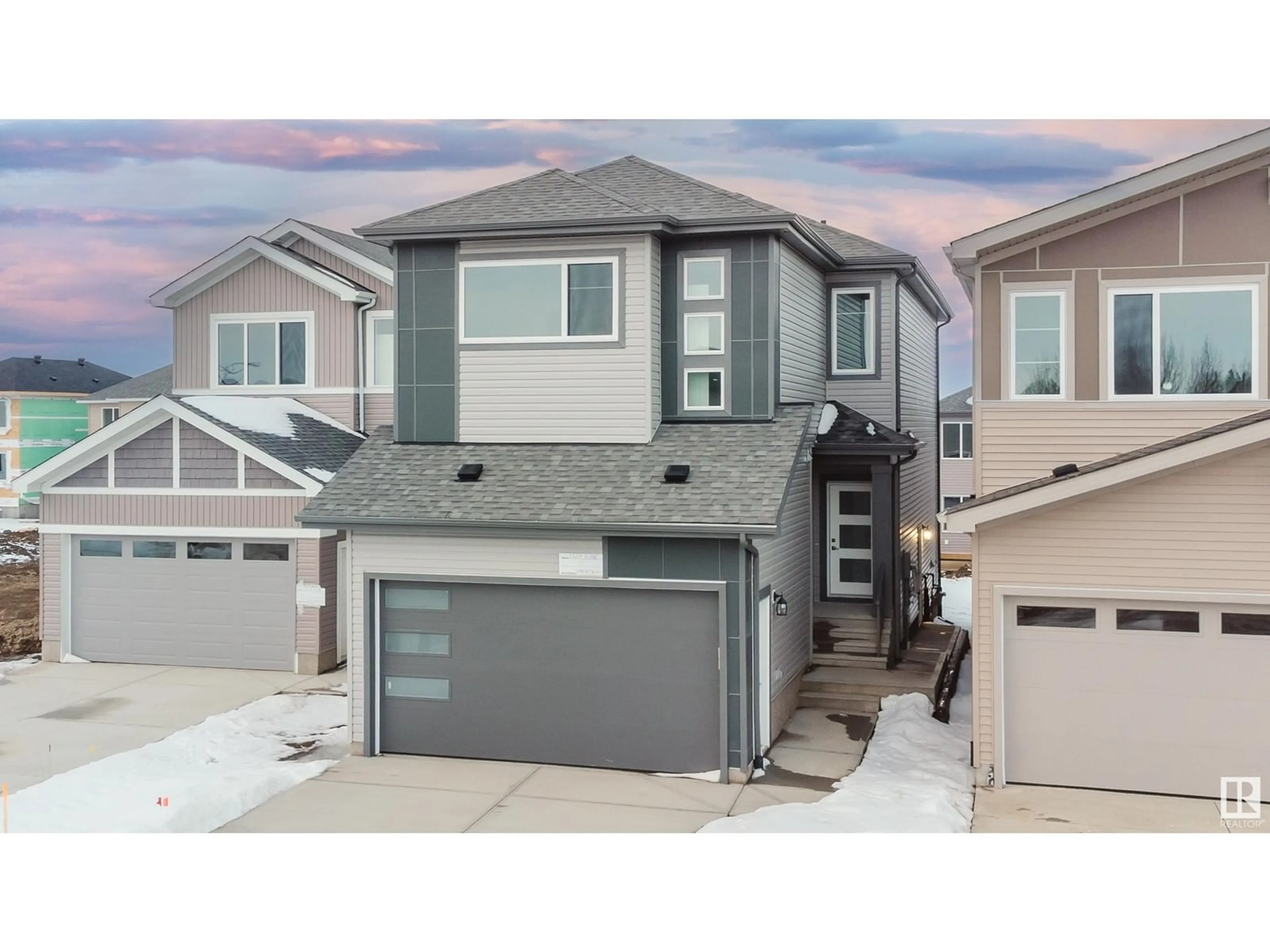 Home with vinyl exterior material, street for 1320 11 AV NW, Edmonton Alberta T6T2W3