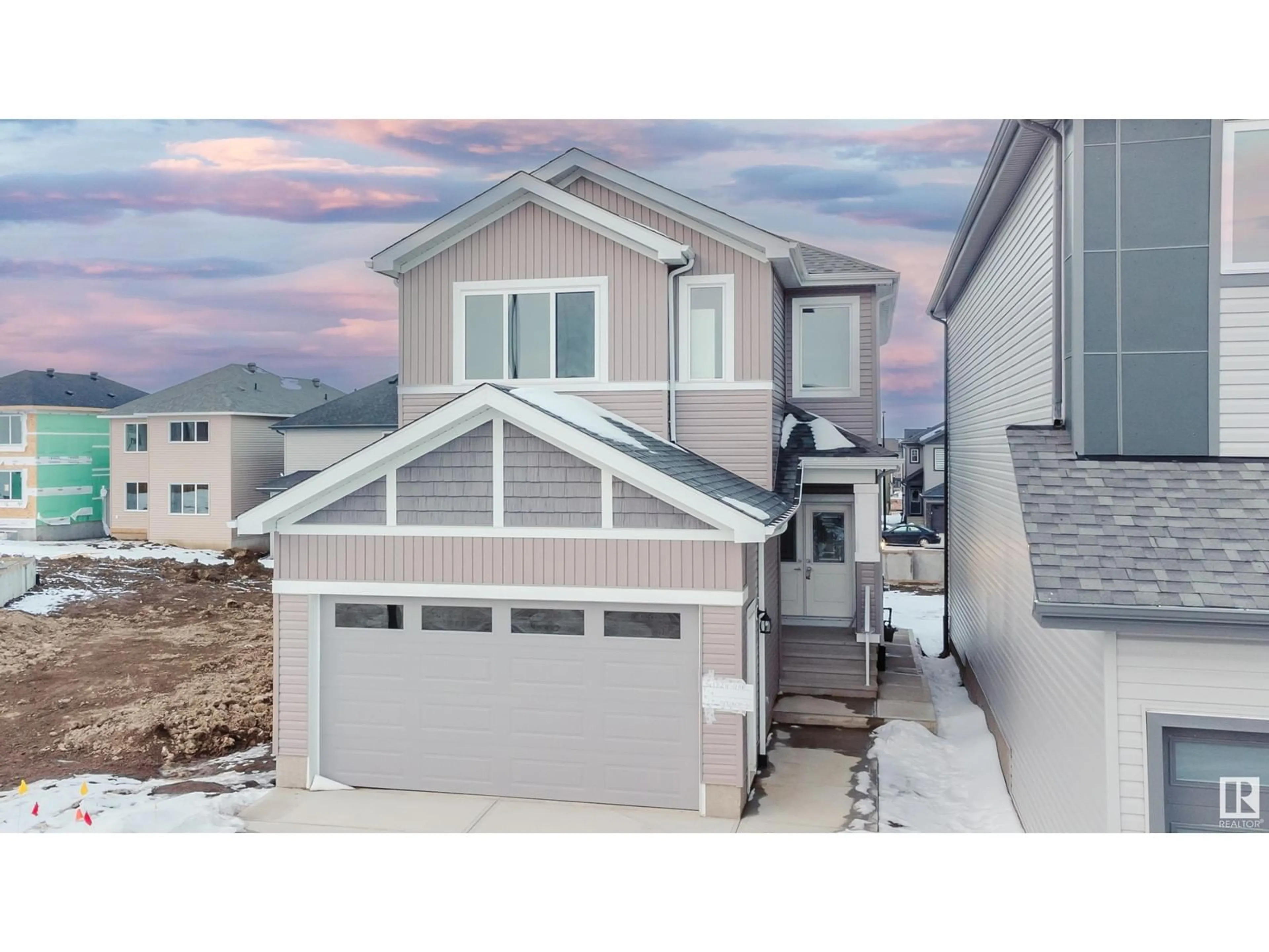 Home with vinyl exterior material, street for 1324 11 AV NW, Edmonton Alberta T6T2W3