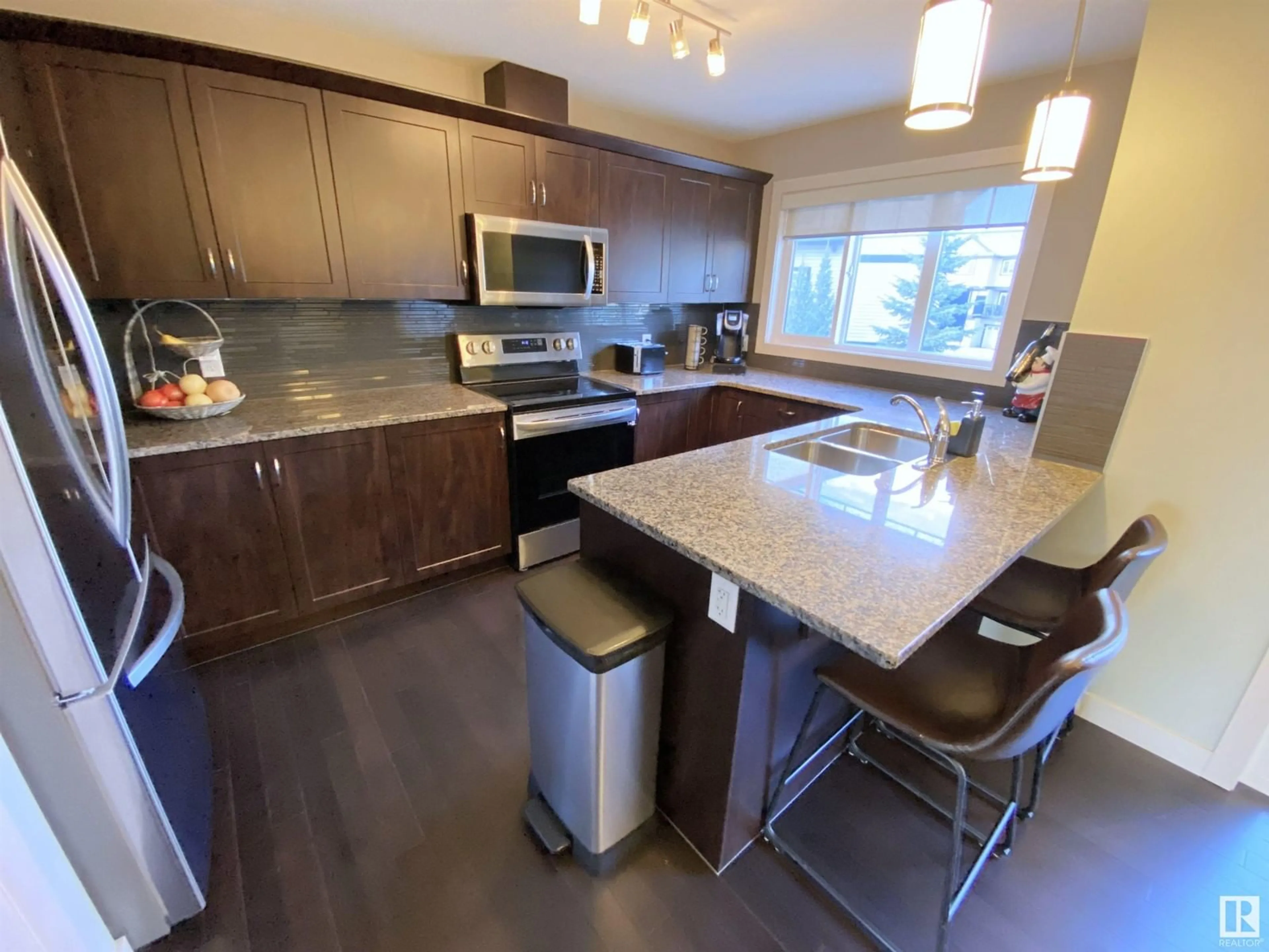 Open concept kitchen, unknown for #9 1776 CUNNINGHAM WY SW, Edmonton Alberta T6W2J5