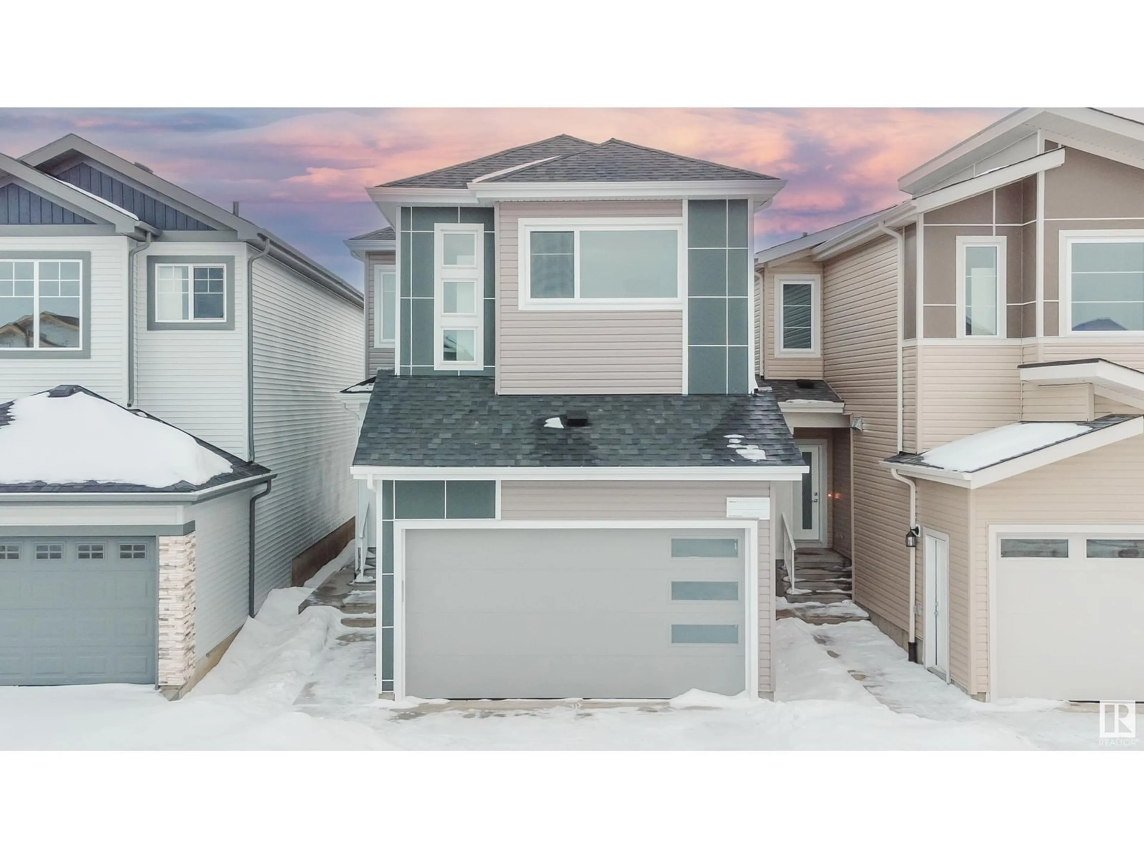 Home with vinyl exterior material, street for 1223 14 AV NW, Edmonton Alberta T6T2W2