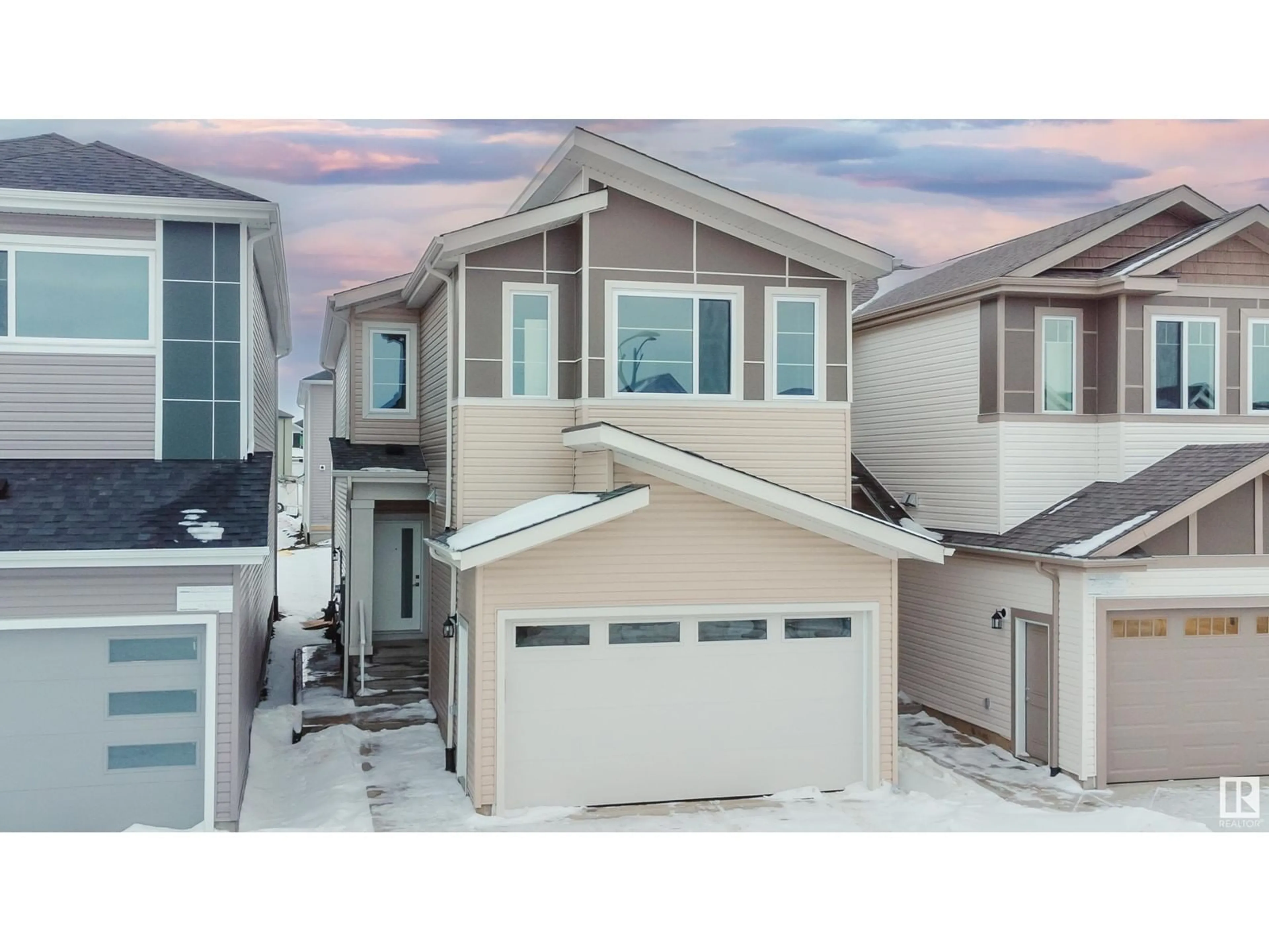 Home with vinyl exterior material, street for 1227 14 AV NW, Edmonton Alberta T6T2W2