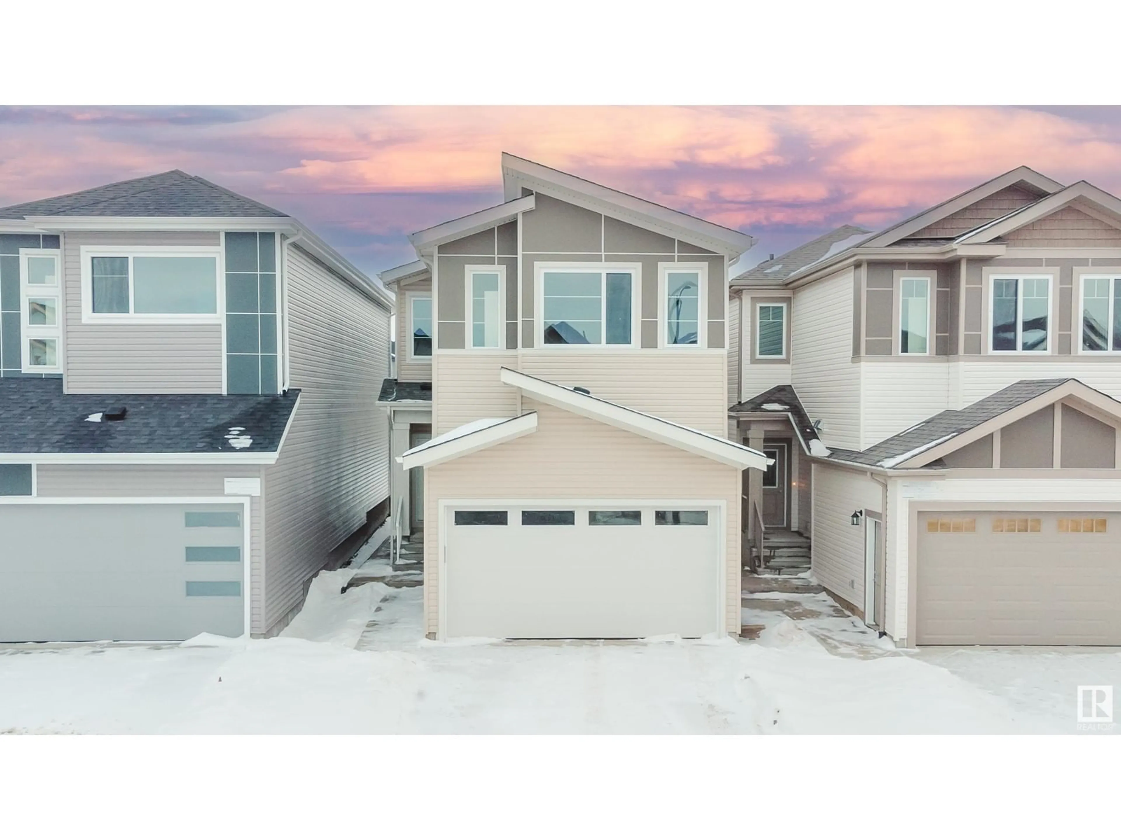 Home with vinyl exterior material, street for 1227 14 AV NW, Edmonton Alberta T6T2W2