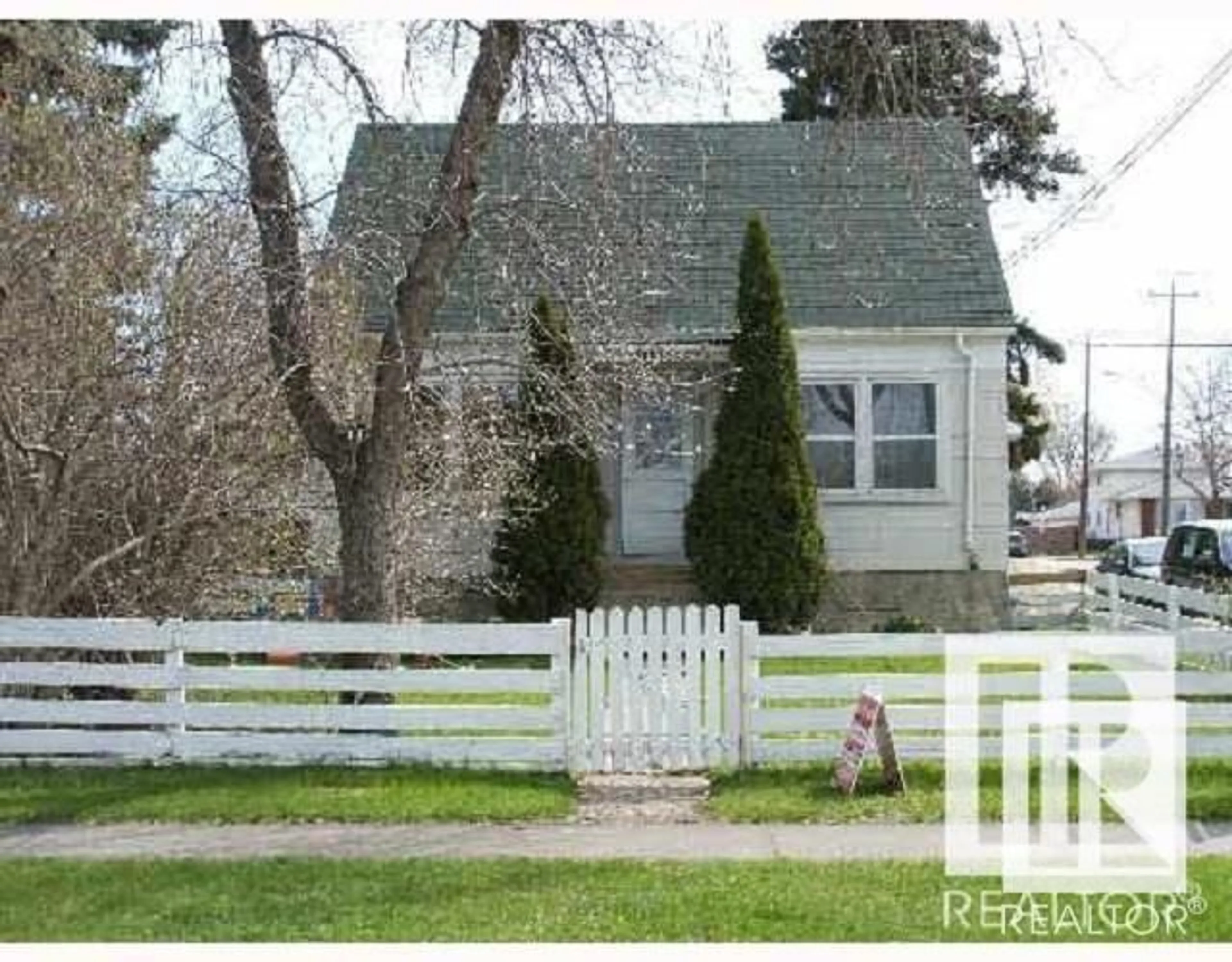 Home with vinyl exterior material, street for 11503 89 ST NW, Edmonton Alberta T5B3V1