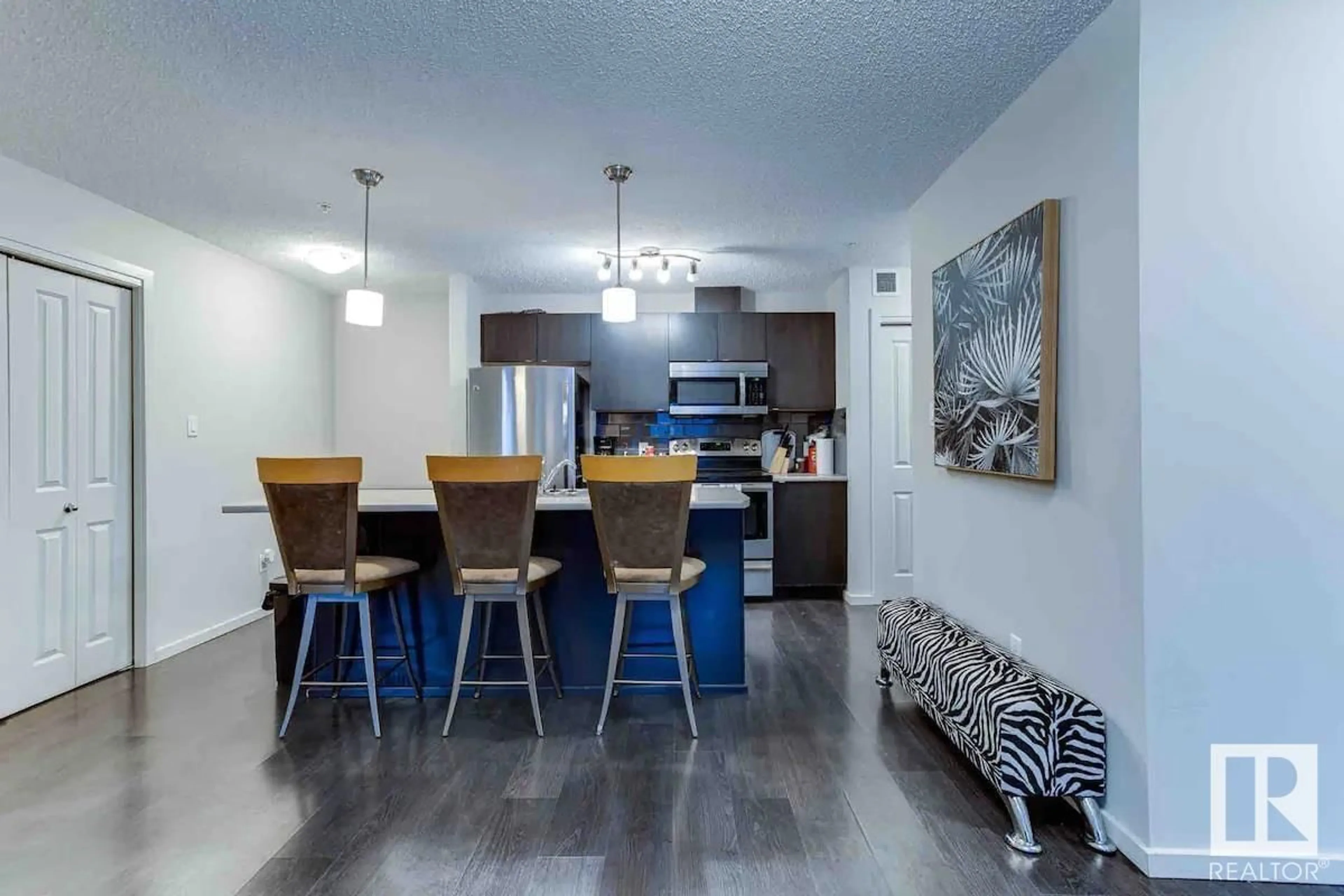 Open concept kitchen, wood/laminate floor for #147 348 WINDERMERE RD NW, Edmonton Alberta T6W2P2