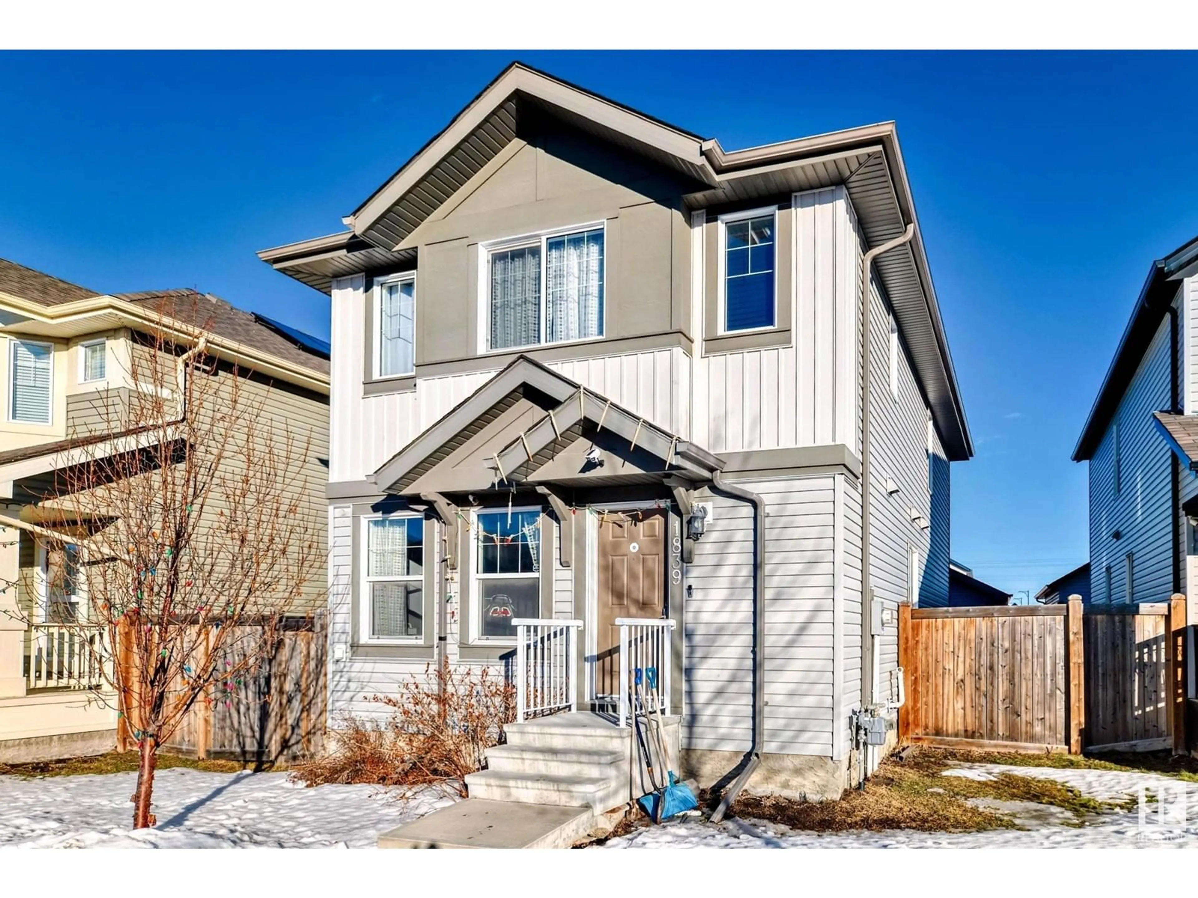 Home with vinyl exterior material, street for 1839 32 ST NW, Edmonton Alberta T6T0N7