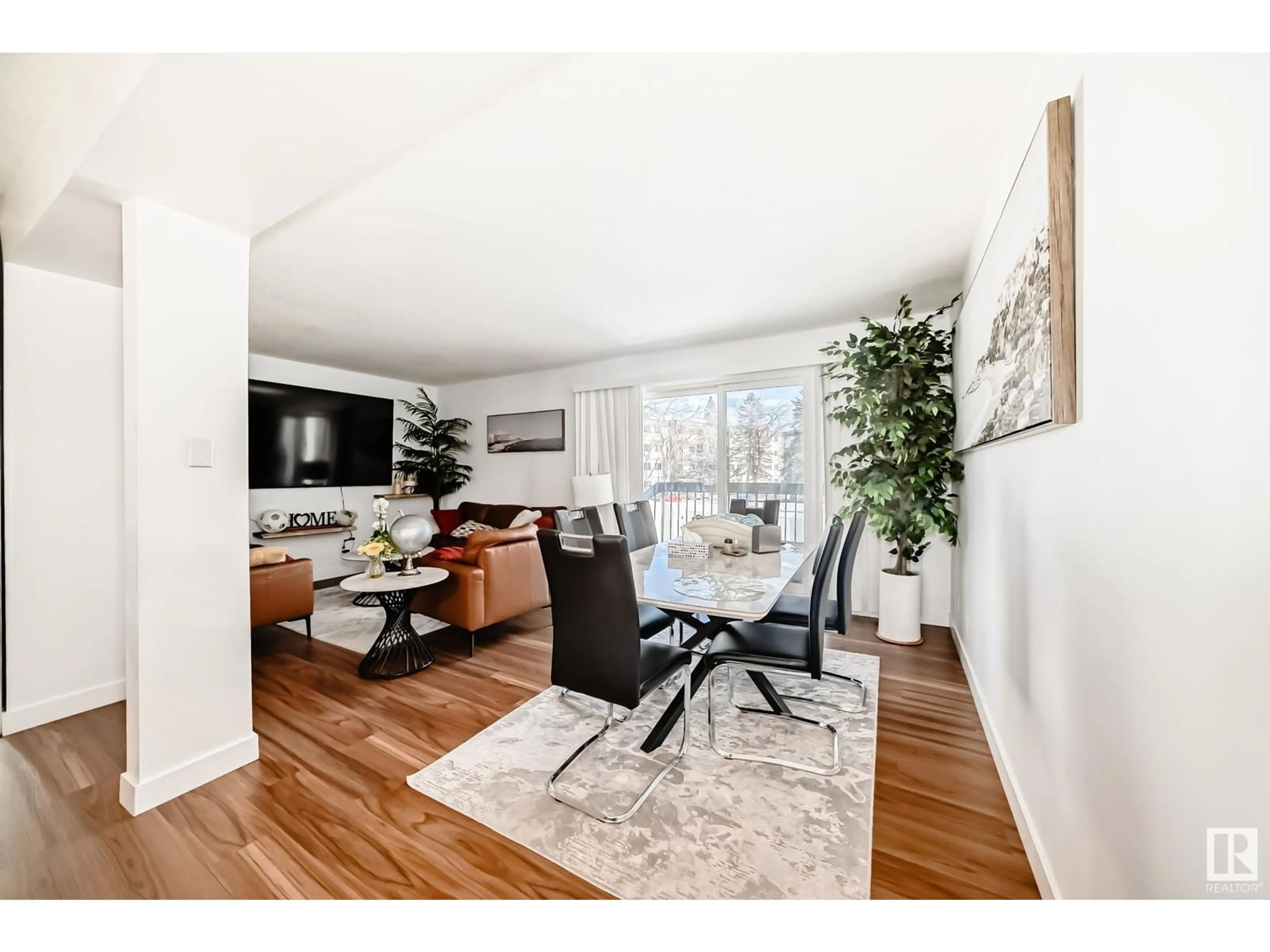 Living room with furniture, wood/laminate floor for 5507 144A AV, Edmonton Alberta T5A3R2