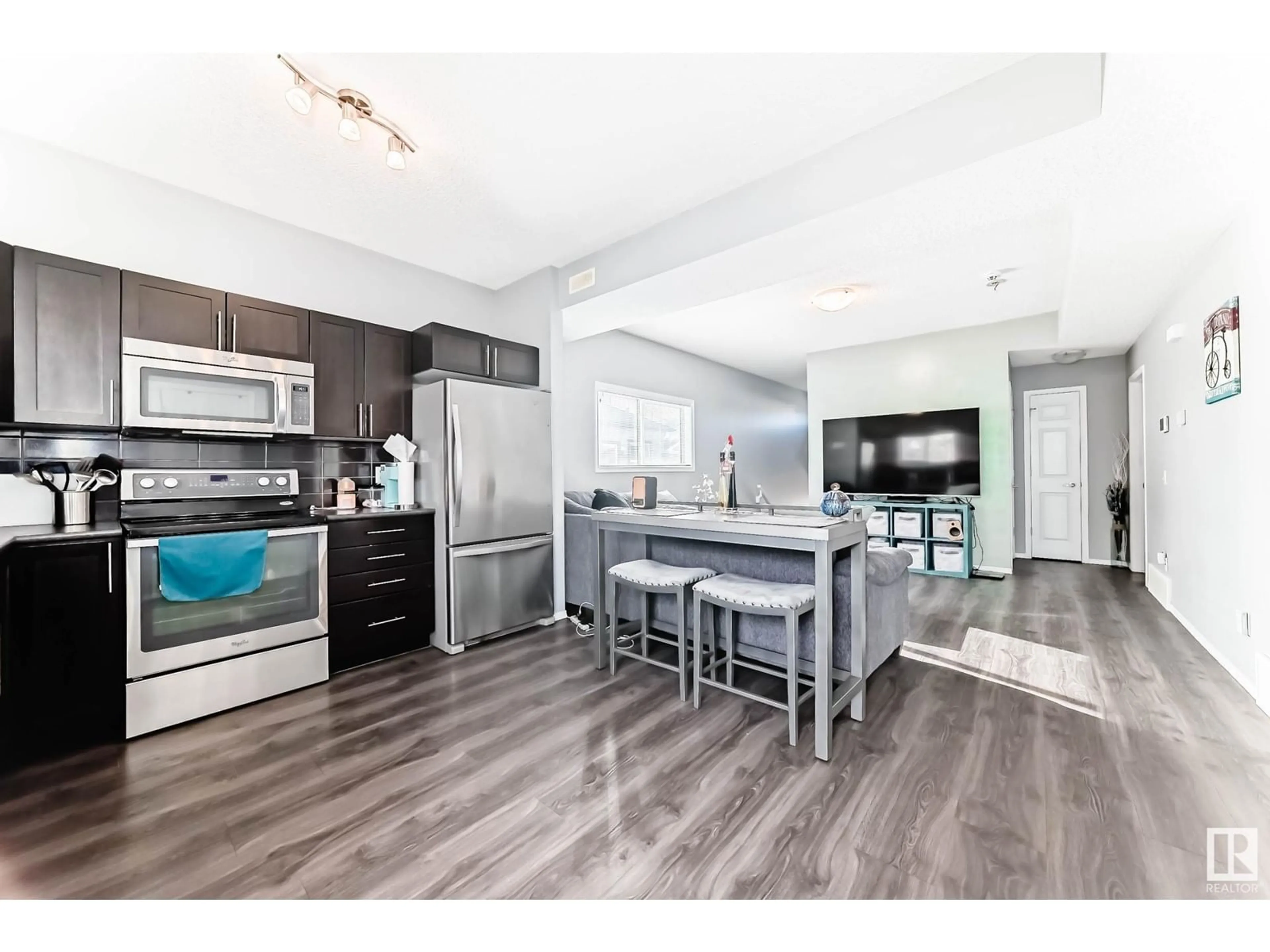 Open concept kitchen, unknown for #9 6520 2 AV SW, Edmonton Alberta T6X1S4