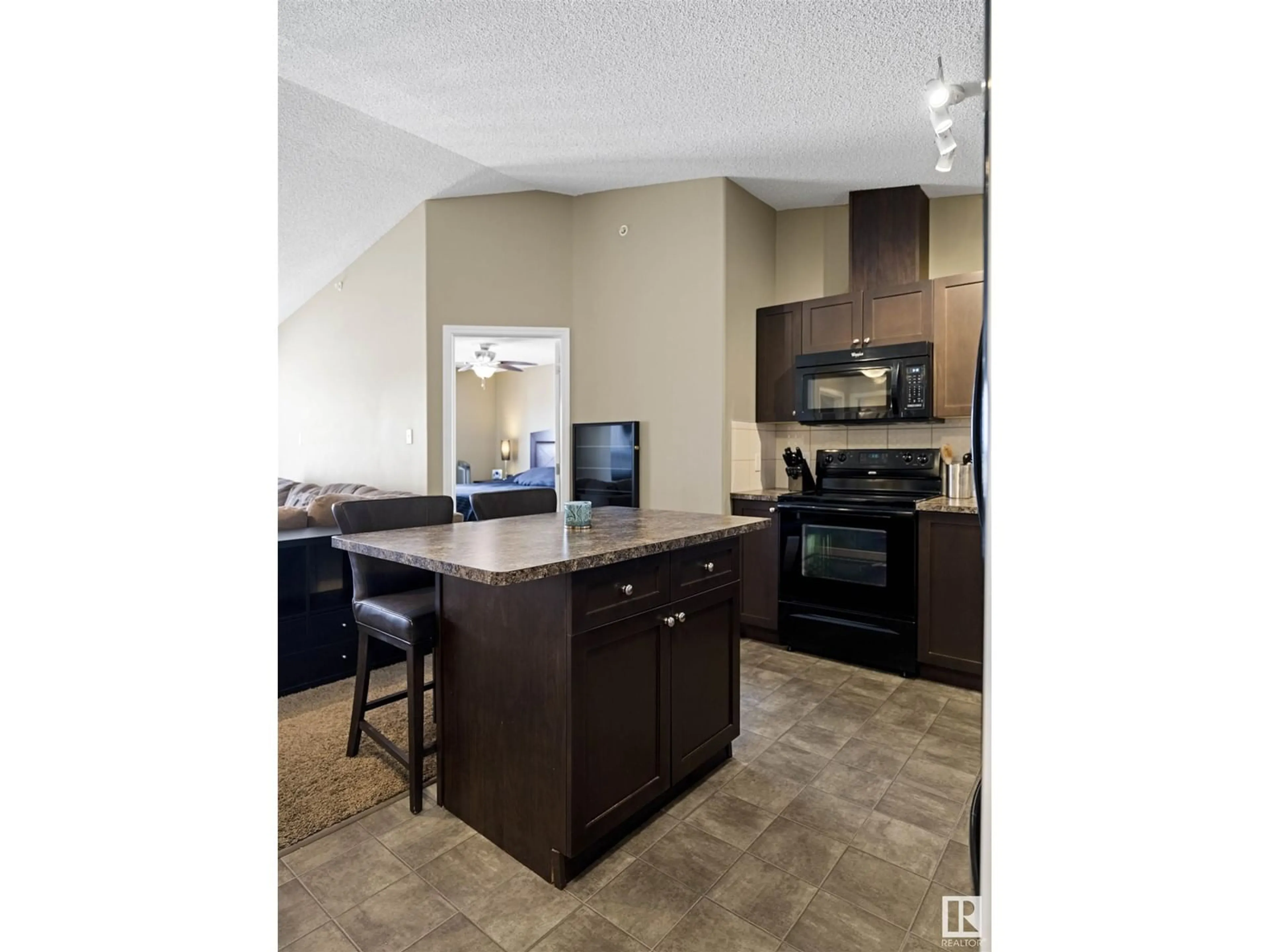 Open concept kitchen, ceramic/tile floor for #409 1520 HAMMOND GA NW, Edmonton Alberta T6M0J4