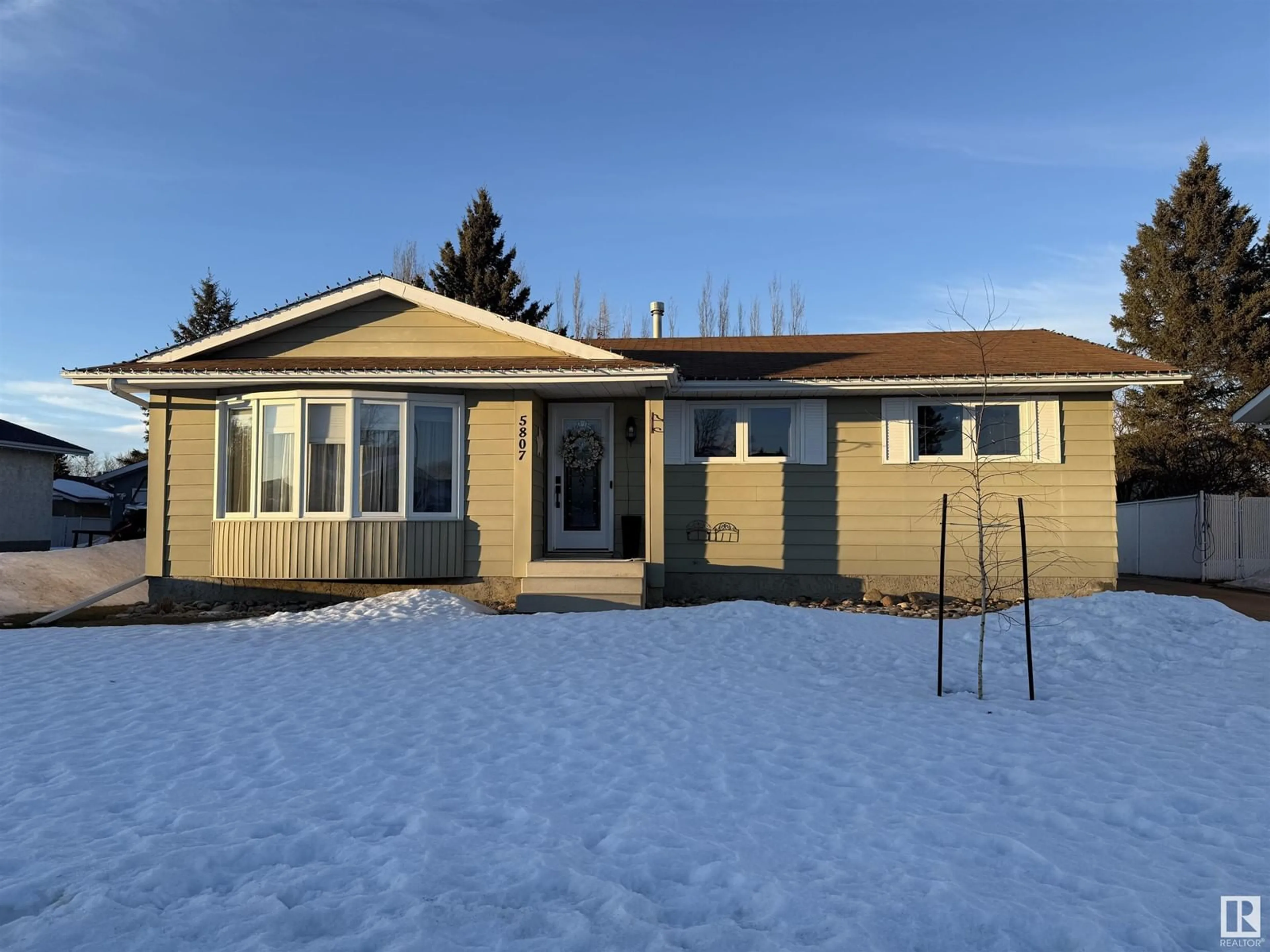 Home with vinyl exterior material, street for 5807 53 AV, Redwater Alberta T0A2W0