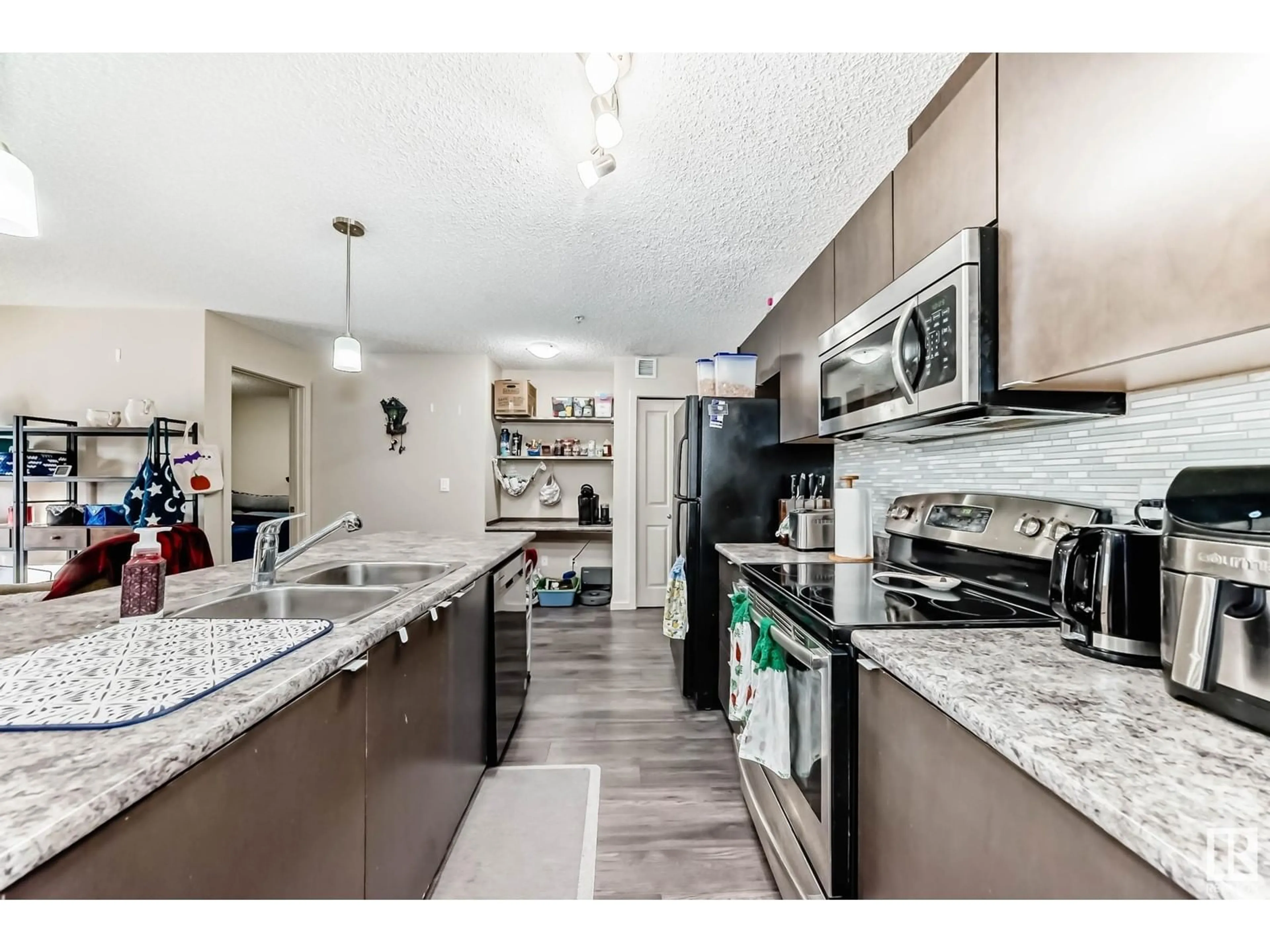 Open concept kitchen, unknown for #305 3353 16A AV NW, Edmonton Alberta T6T0V4