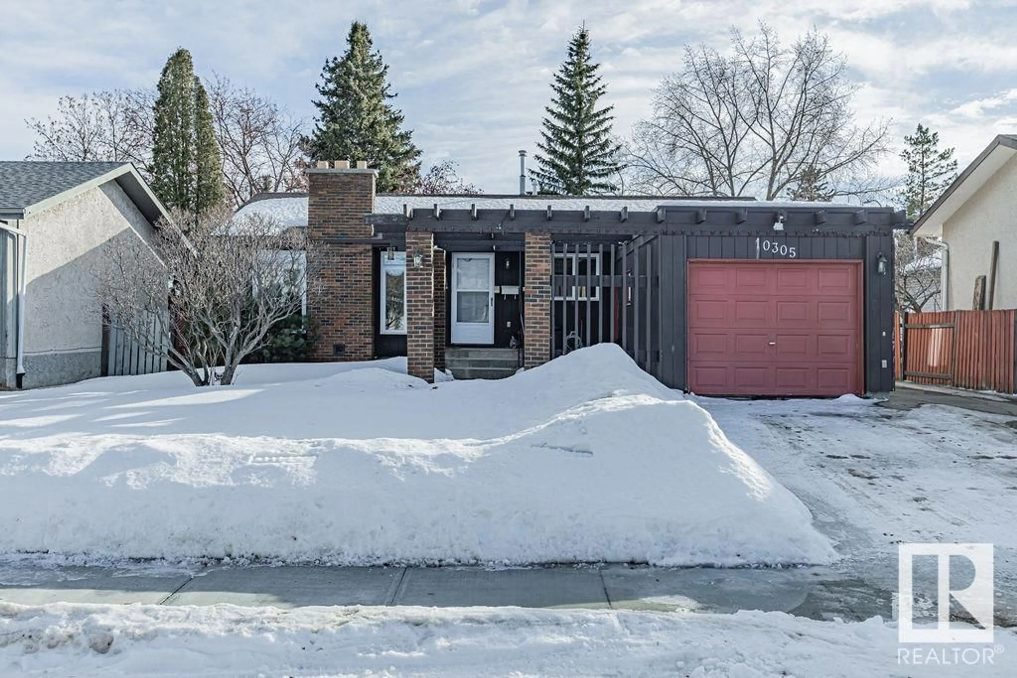 Home with brick exterior material, street for 10305 167A AV NW, Edmonton Alberta T5X2Y8