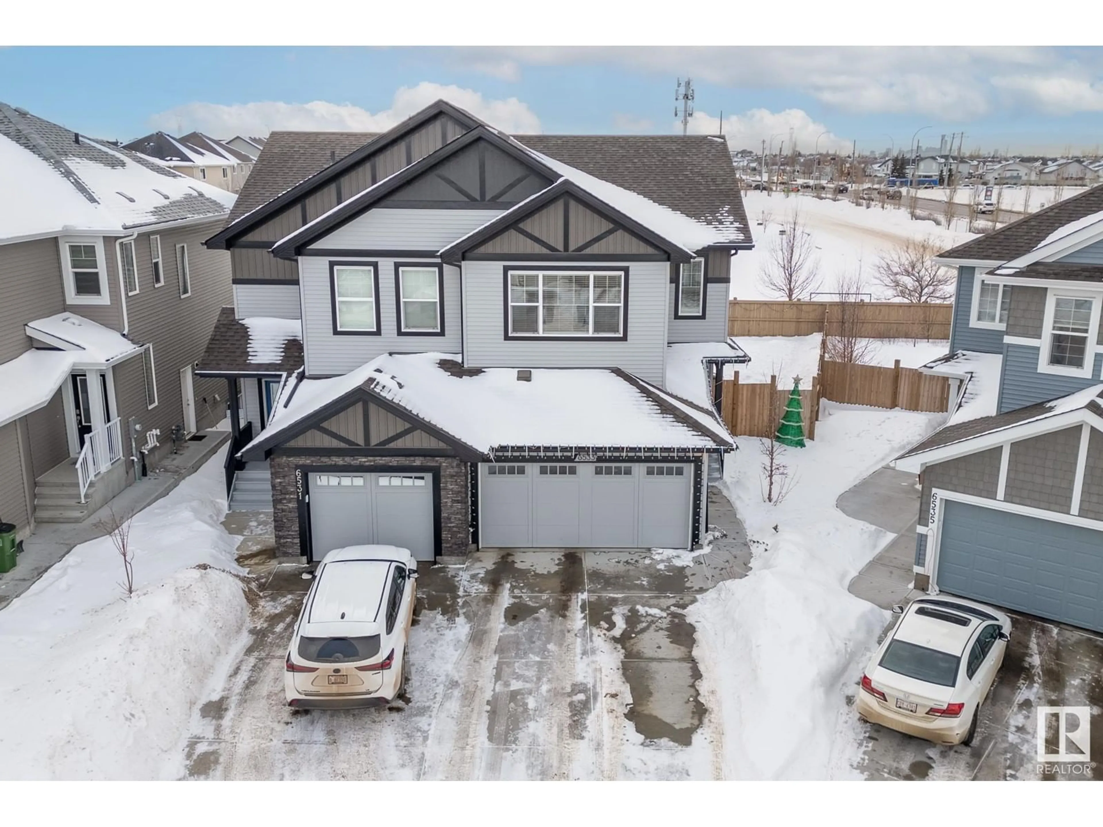 A pic from outside/outdoor area/front of a property/back of a property/a pic from drone, mountain view for 6533 168 AV NW NW, Edmonton Alberta T5Y3X9