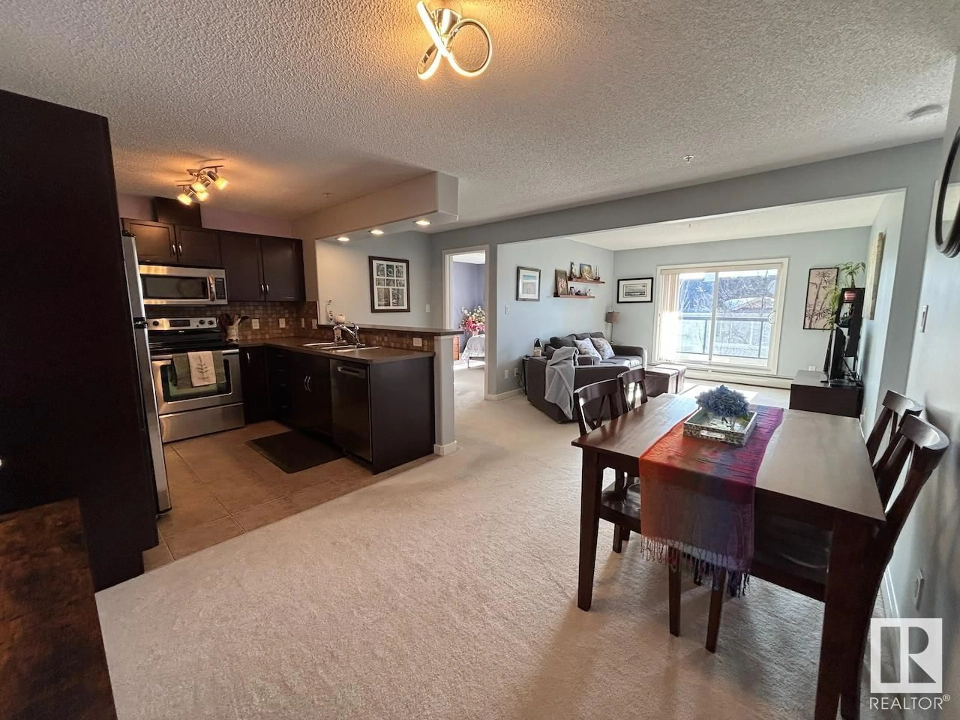 Open concept kitchen, unknown for #331 11603 ELLERSLIE RD SW, Edmonton Alberta T6W0J3