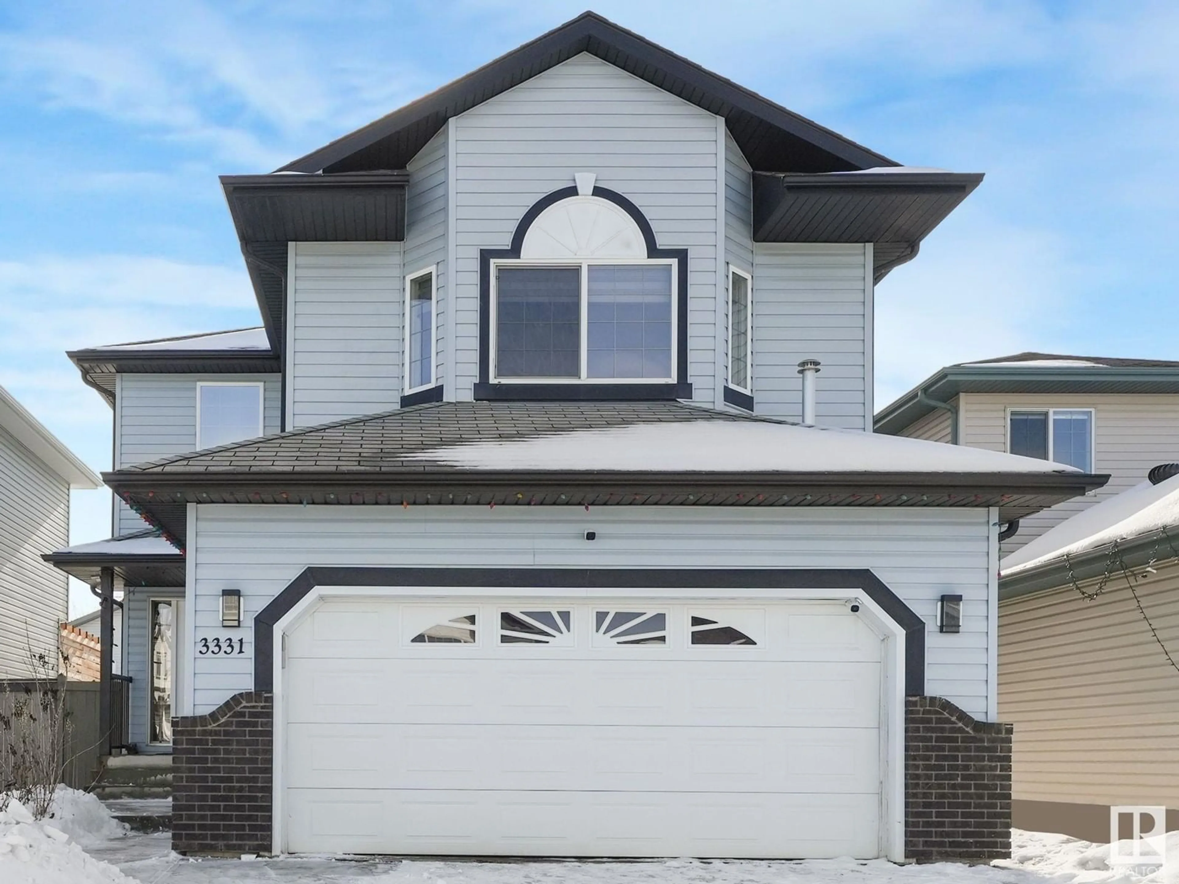 Home with vinyl exterior material, street for 3331 25 AV NW NW, Edmonton Alberta T6T1Y3