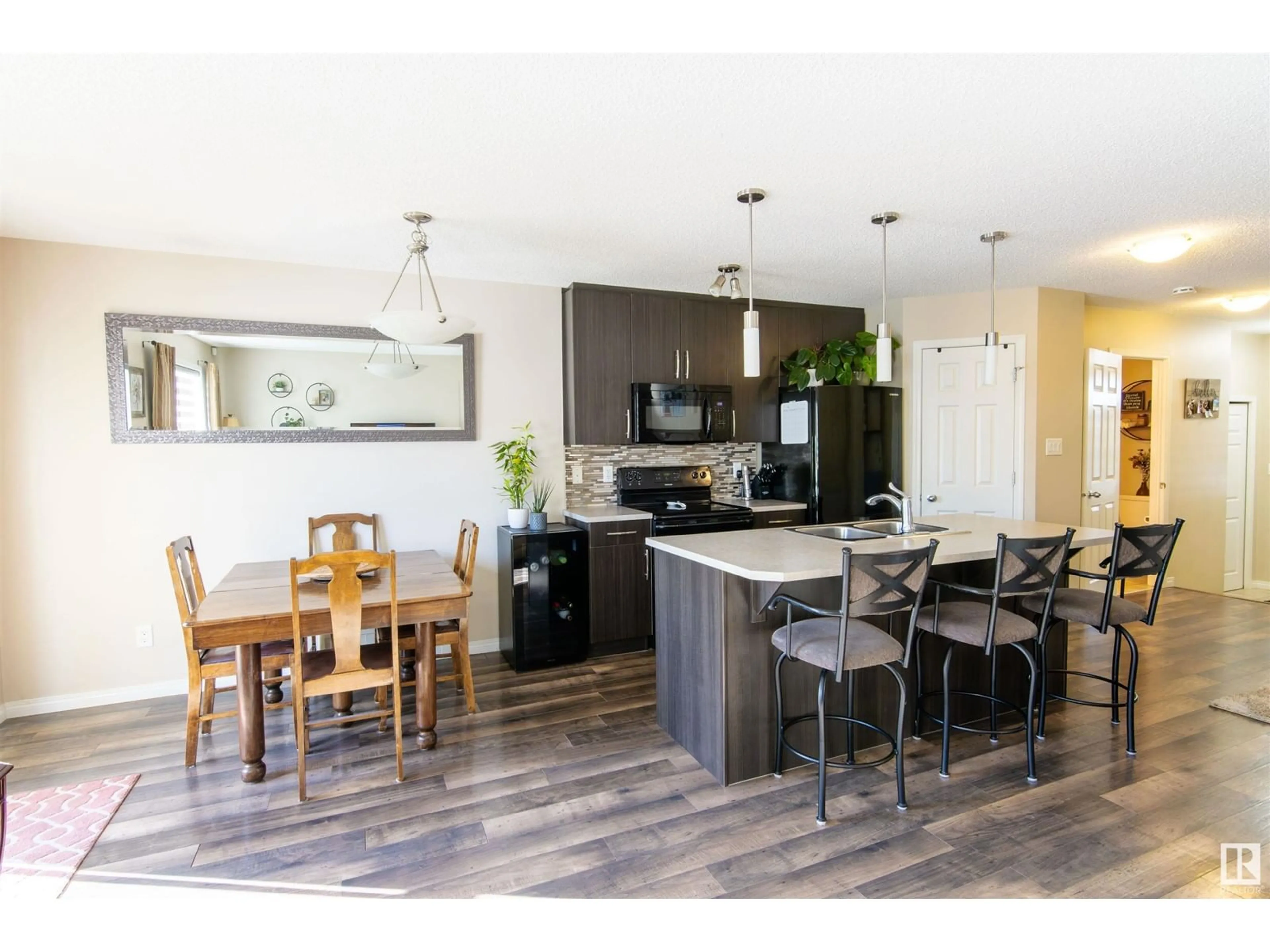 Open concept kitchen, wood/laminate floor for 4689 CRABAPPLE RUN SW, Edmonton Alberta T6X0Y8