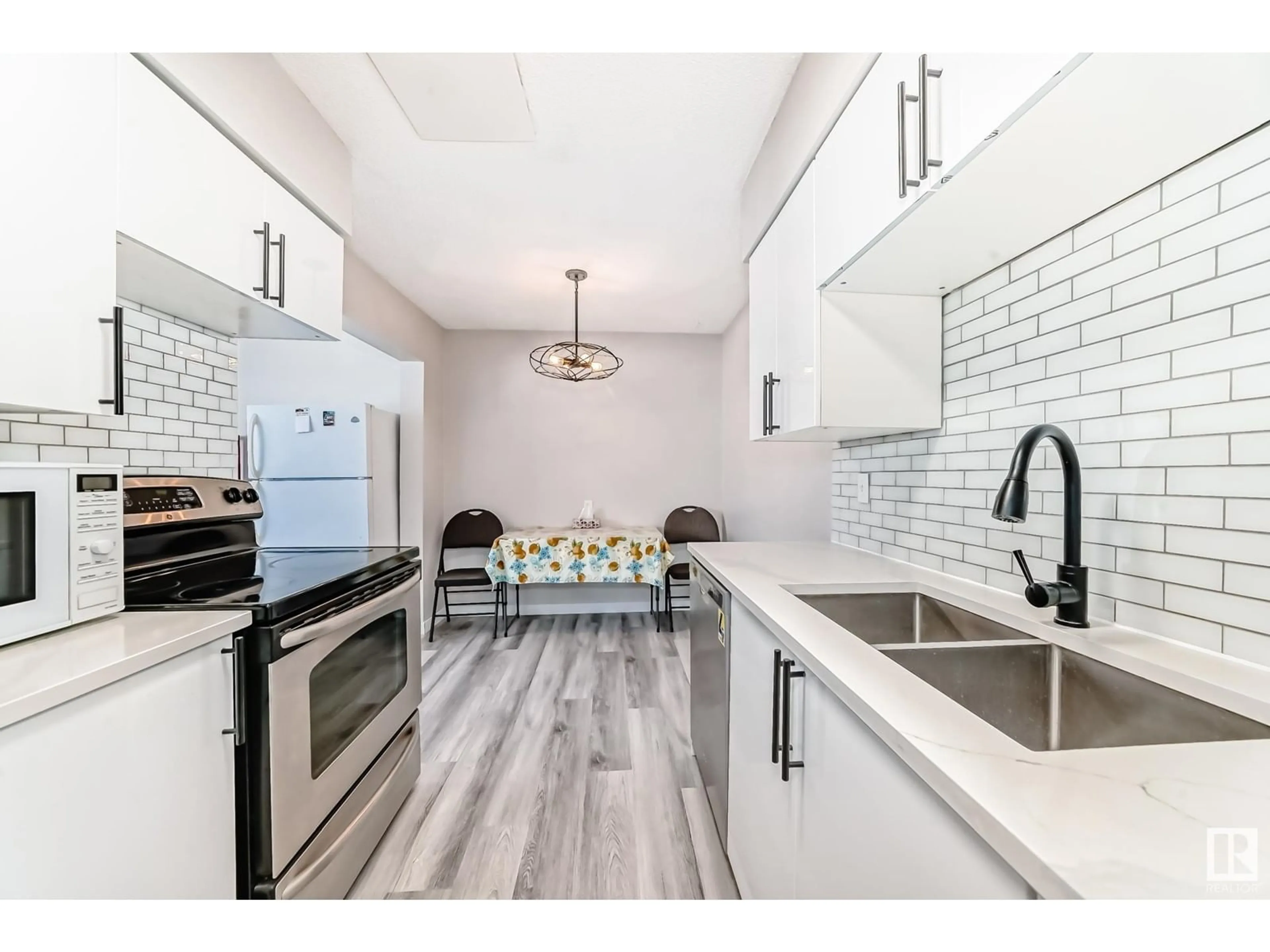 Open concept kitchen, ceramic/tile floor for #4 14120 80 ST NW, Edmonton Alberta T5C1L6