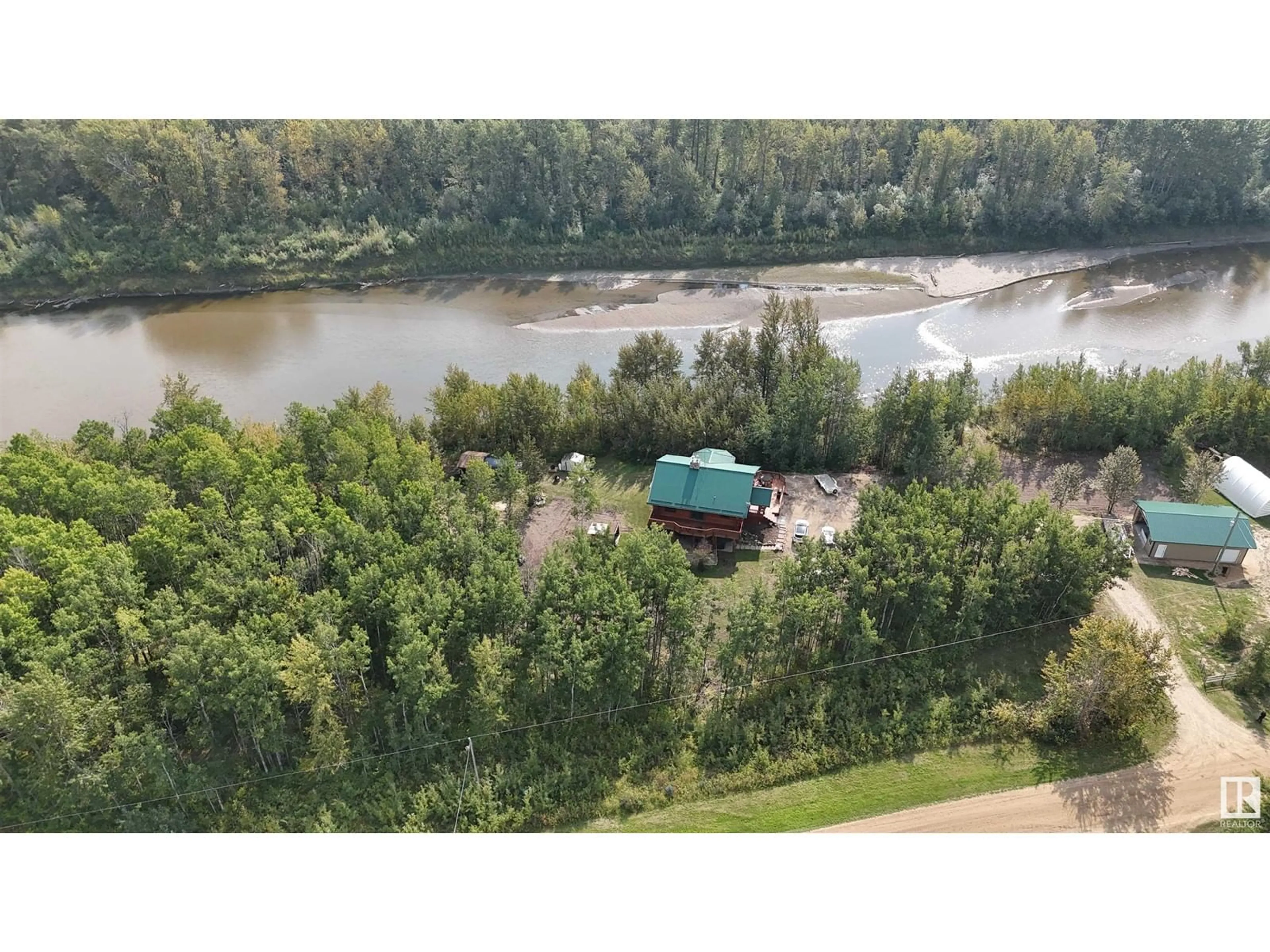 A pic from outside/outdoor area/front of a property/back of a property/a pic from drone, water/lake/river/ocean view for 58211 RR 31, Rural Barrhead County Alberta T7N1N4