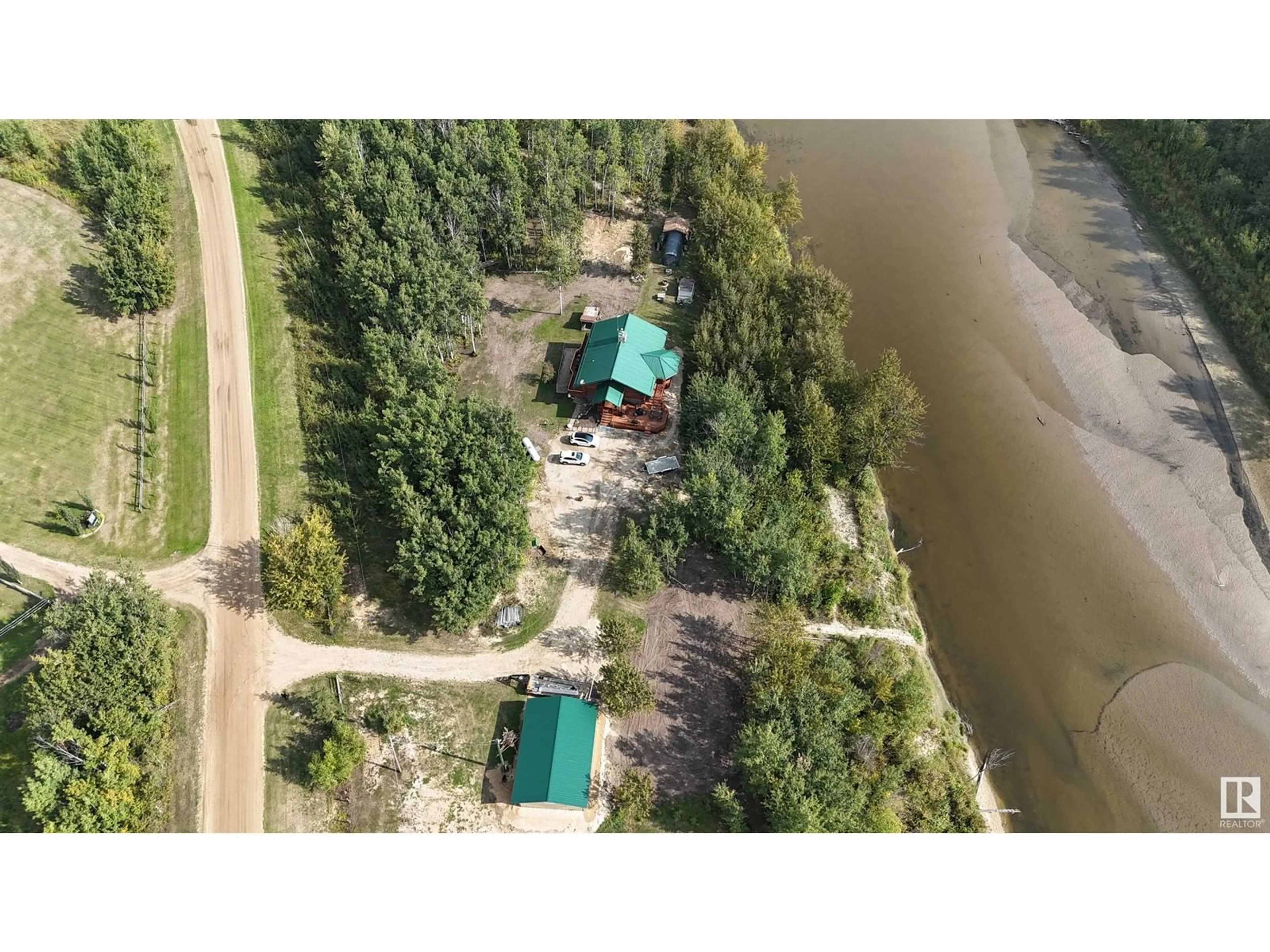 A pic from outside/outdoor area/front of a property/back of a property/a pic from drone, water/lake/river/ocean view for 58211 RR 31, Rural Barrhead County Alberta T7N1N4