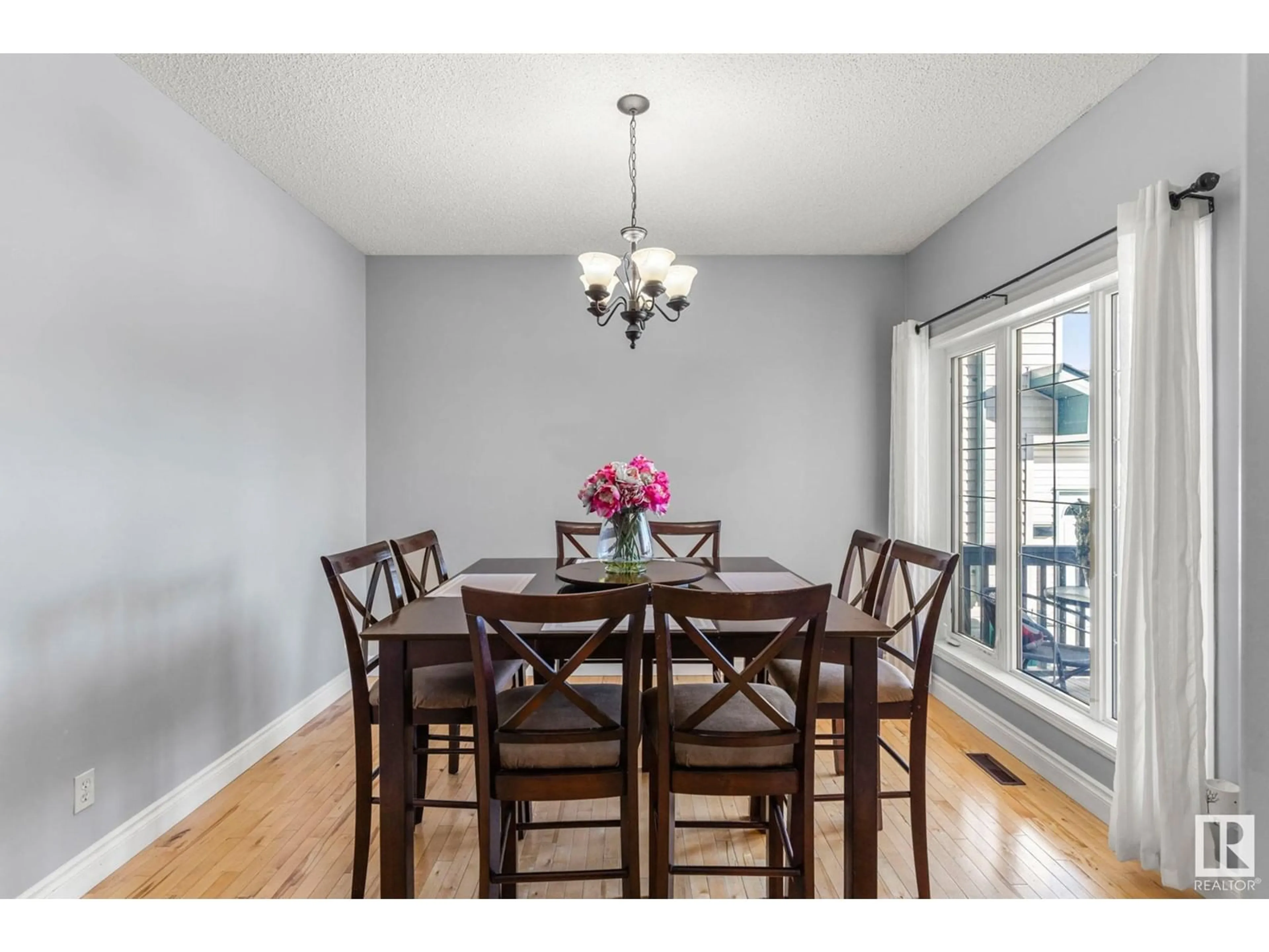 Dining room, wood/laminate floor for 4628 155 AV NW, Edmonton Alberta T5Y3L7