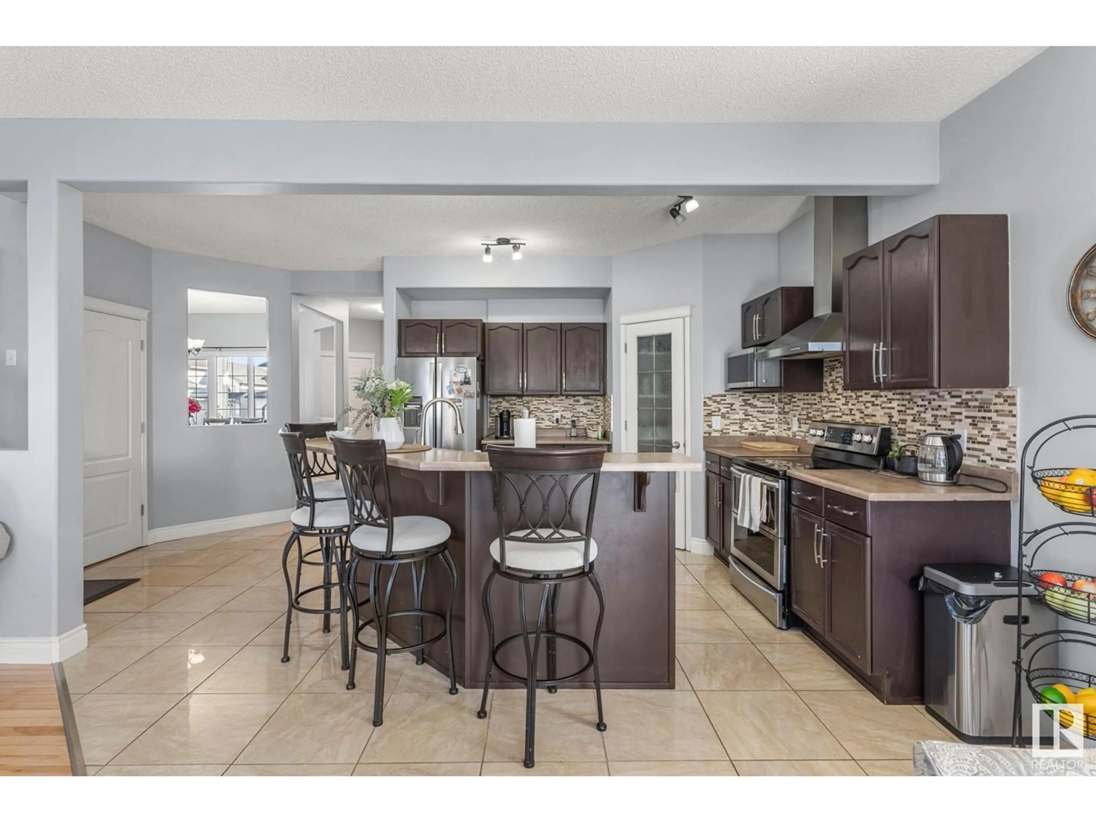 Open concept kitchen, ceramic/tile floor for 4628 155 AV NW, Edmonton Alberta T5Y3L7