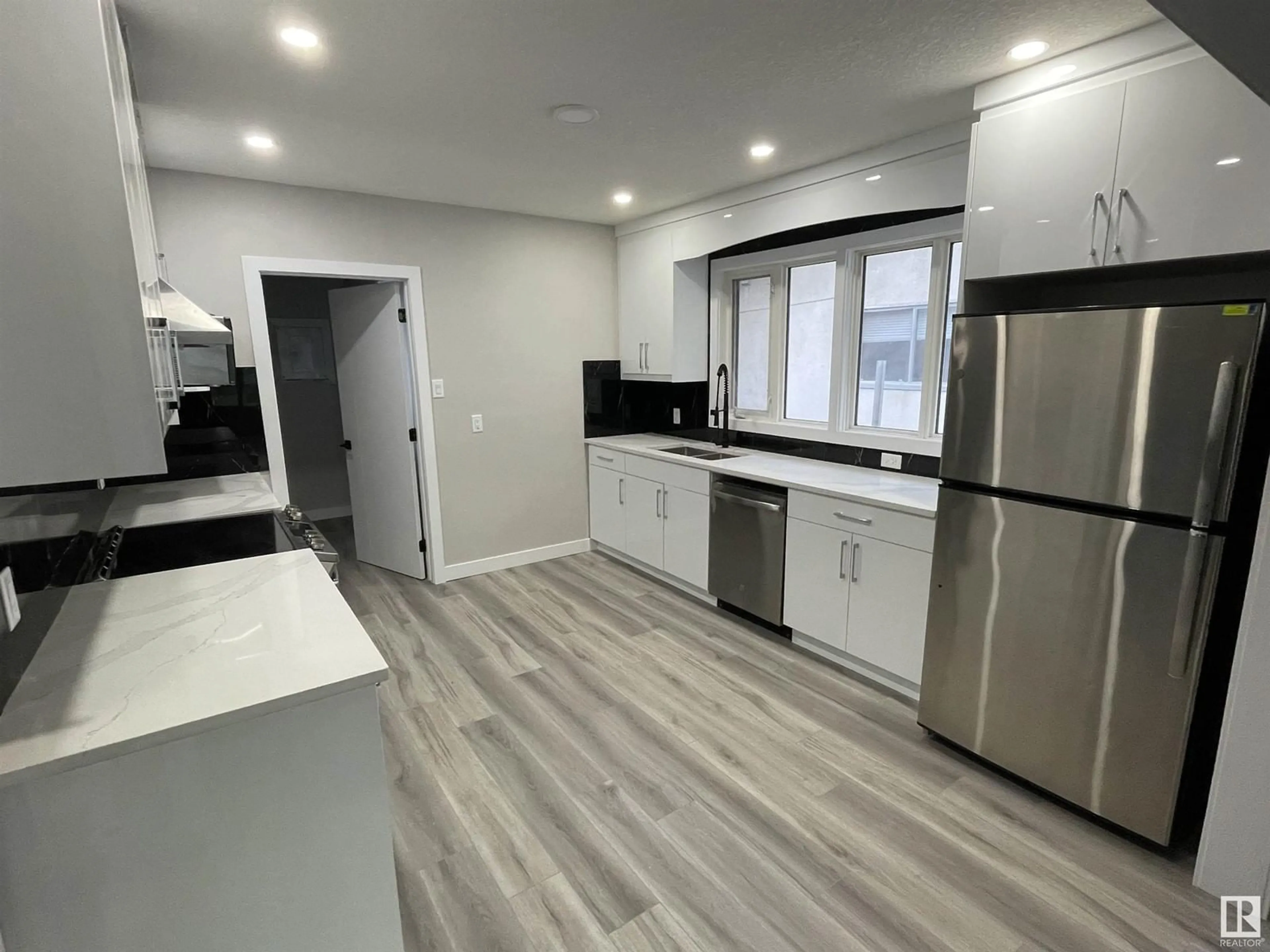 Open concept kitchen, unknown for 10505 76 ST NW, Edmonton Alberta T6A3B2