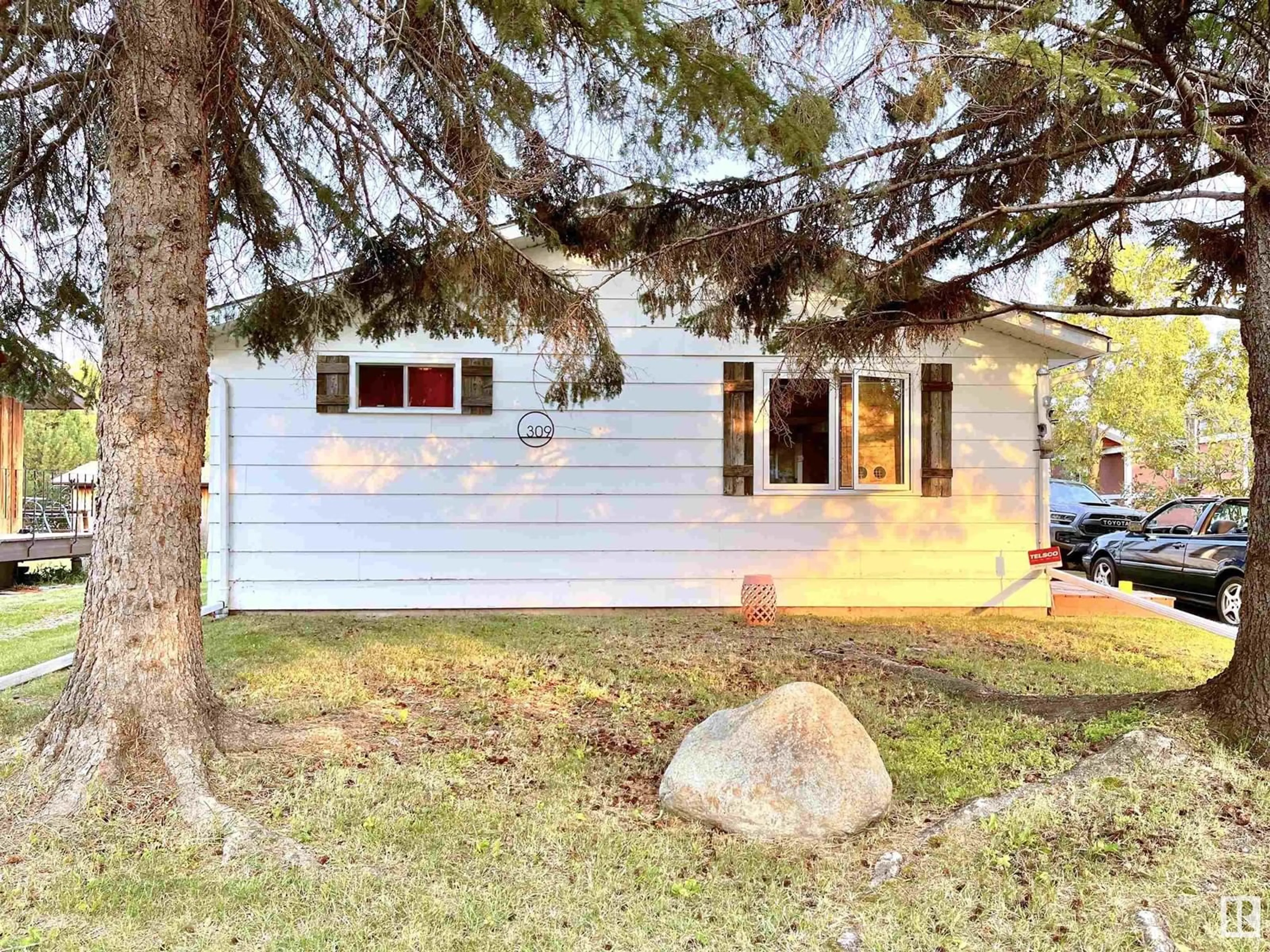 Home with vinyl exterior material, street for 309 3 ST, Rural Lac Ste. Anne County Alberta T0E1A0