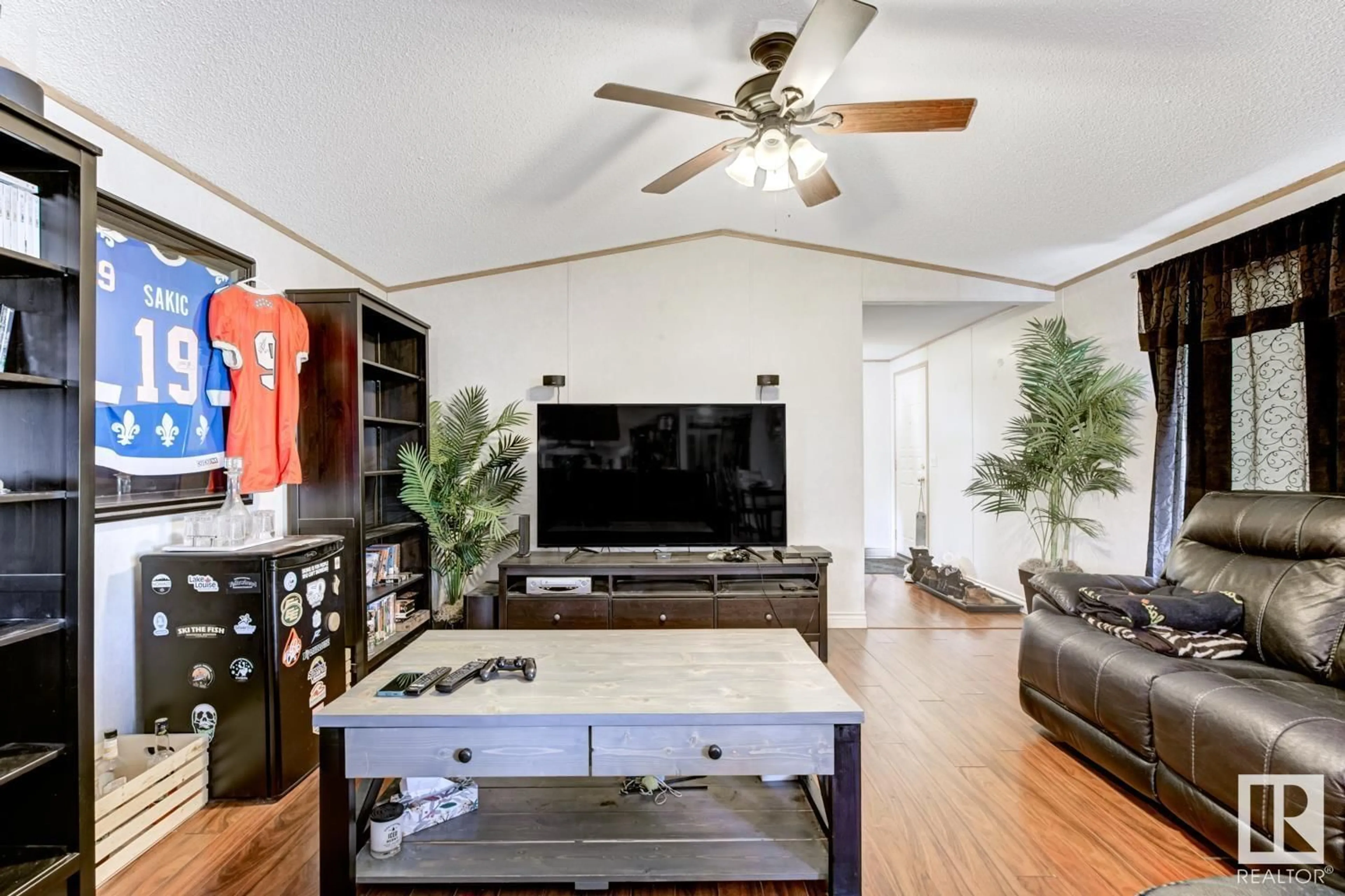 Living room with furniture, wood/laminate floor for 244 Evergreen PA NW, Edmonton Alberta T5Y4M2