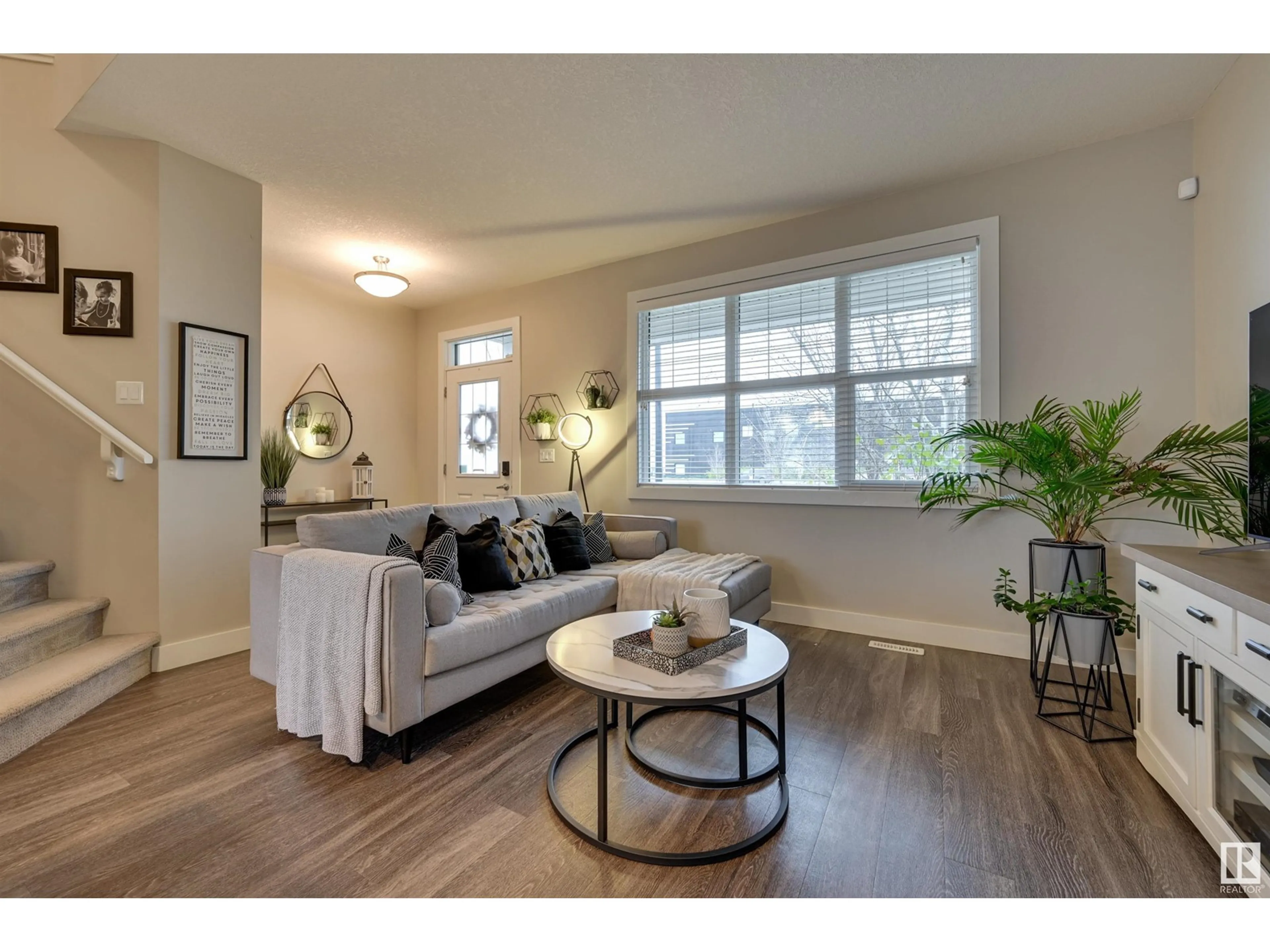 Living room with furniture, wood/laminate floor for 364 CHAPPELLE DR SW, Edmonton Alberta T6W2Z2