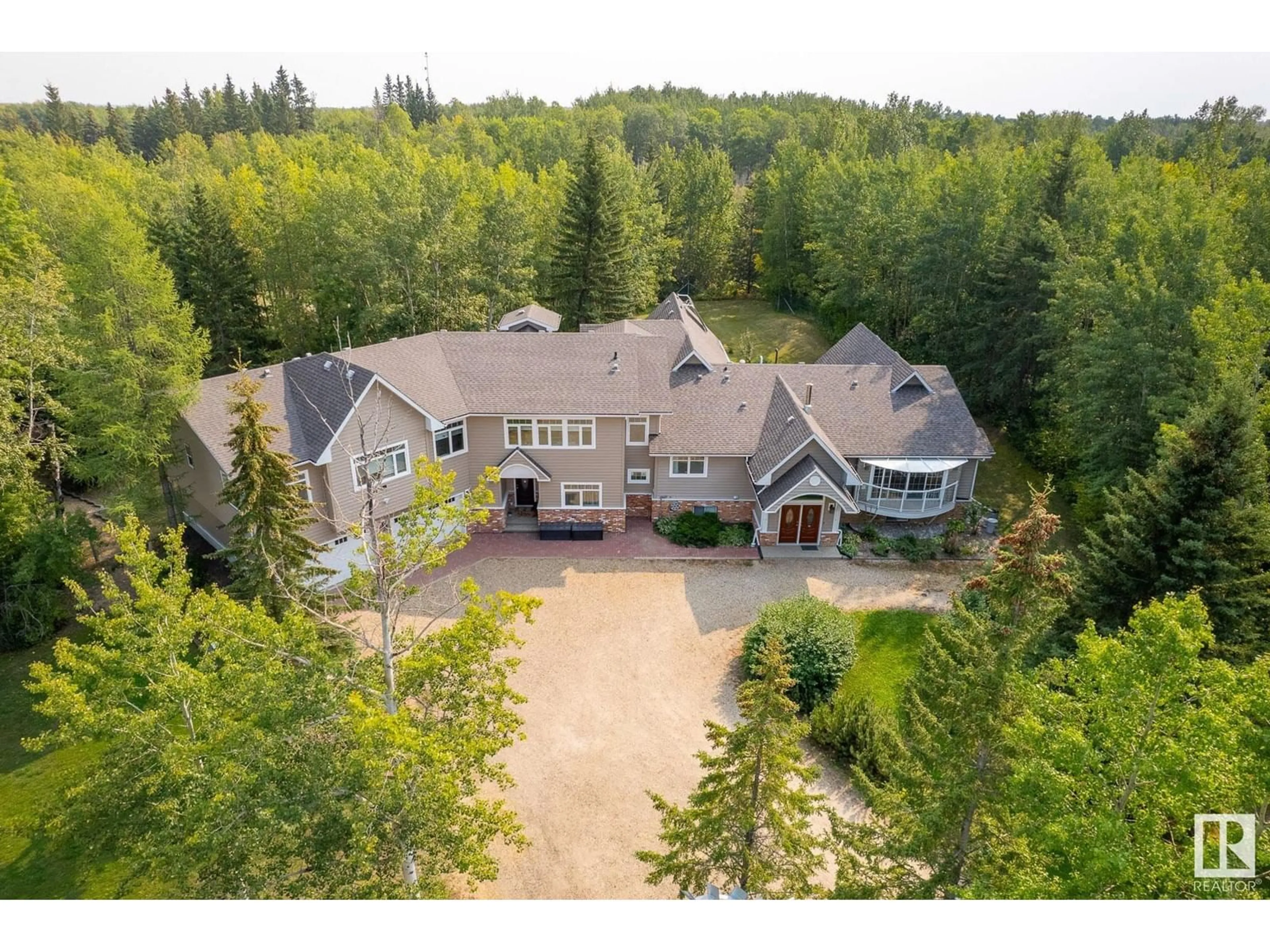 A pic from outside/outdoor area/front of a property/back of a property/a pic from drone, unknown for 109 - 52471 RGE RD 223, Rural Strathcona County Alberta T8A4P9