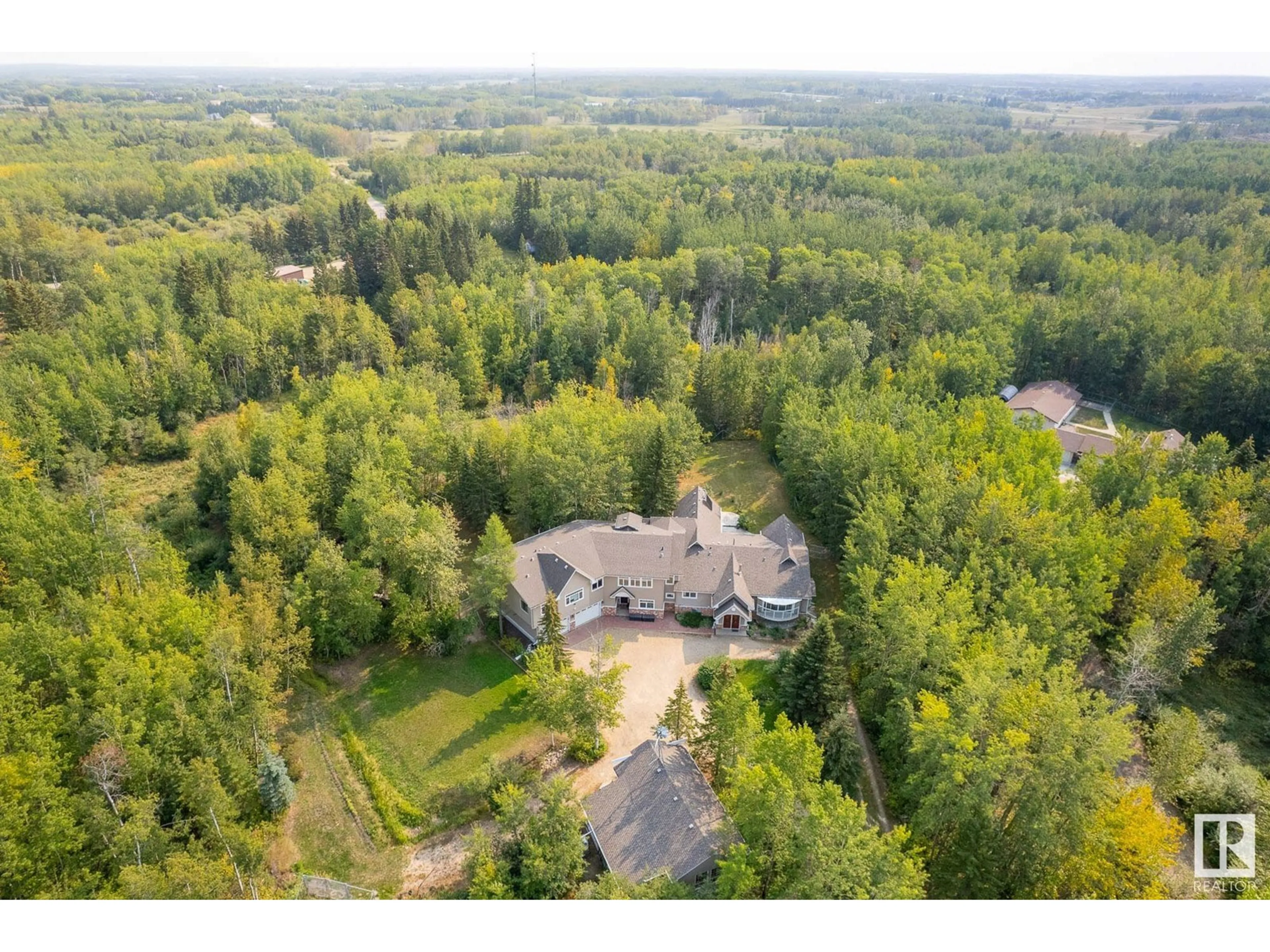 A pic from outside/outdoor area/front of a property/back of a property/a pic from drone, forest/trees view for 109 52471 RGE RD 223, Rural Strathcona County Alberta T8A4P9