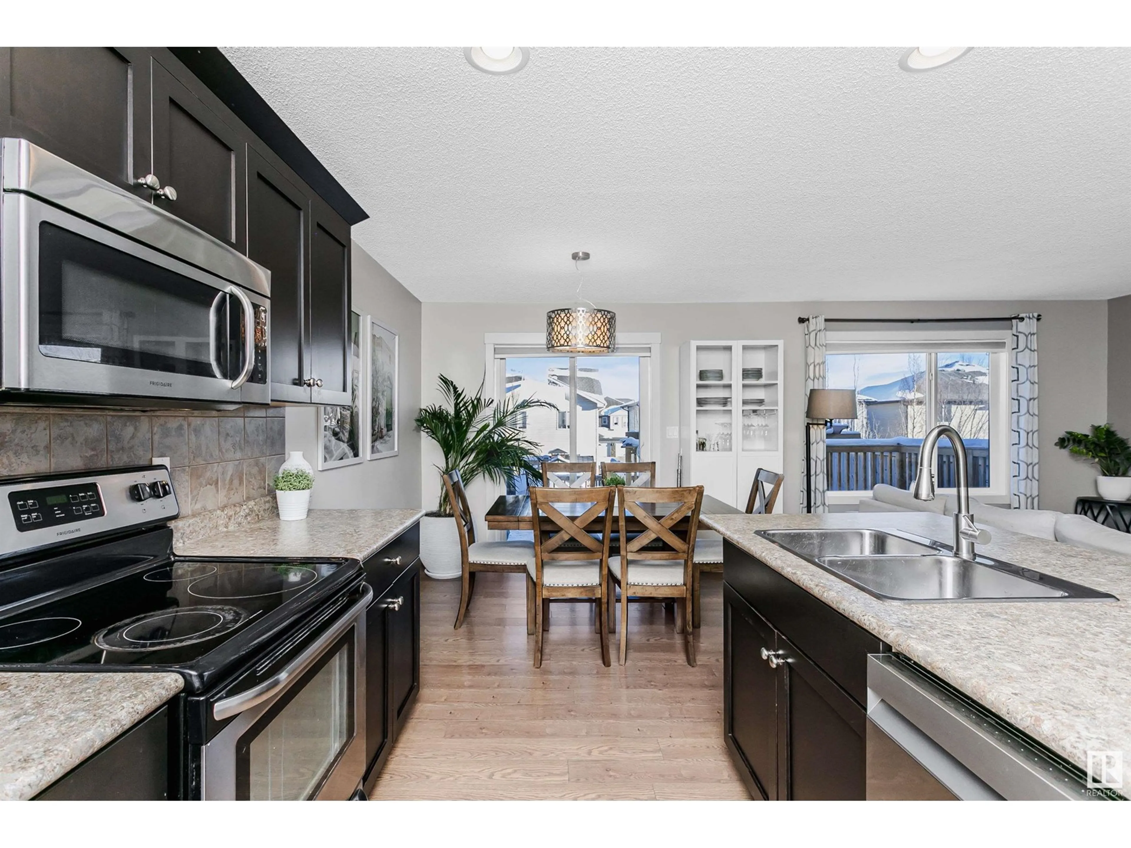 Open concept kitchen, ceramic/tile floor for 22 SUNTERRA WY, Sherwood Park Alberta T8H0R3