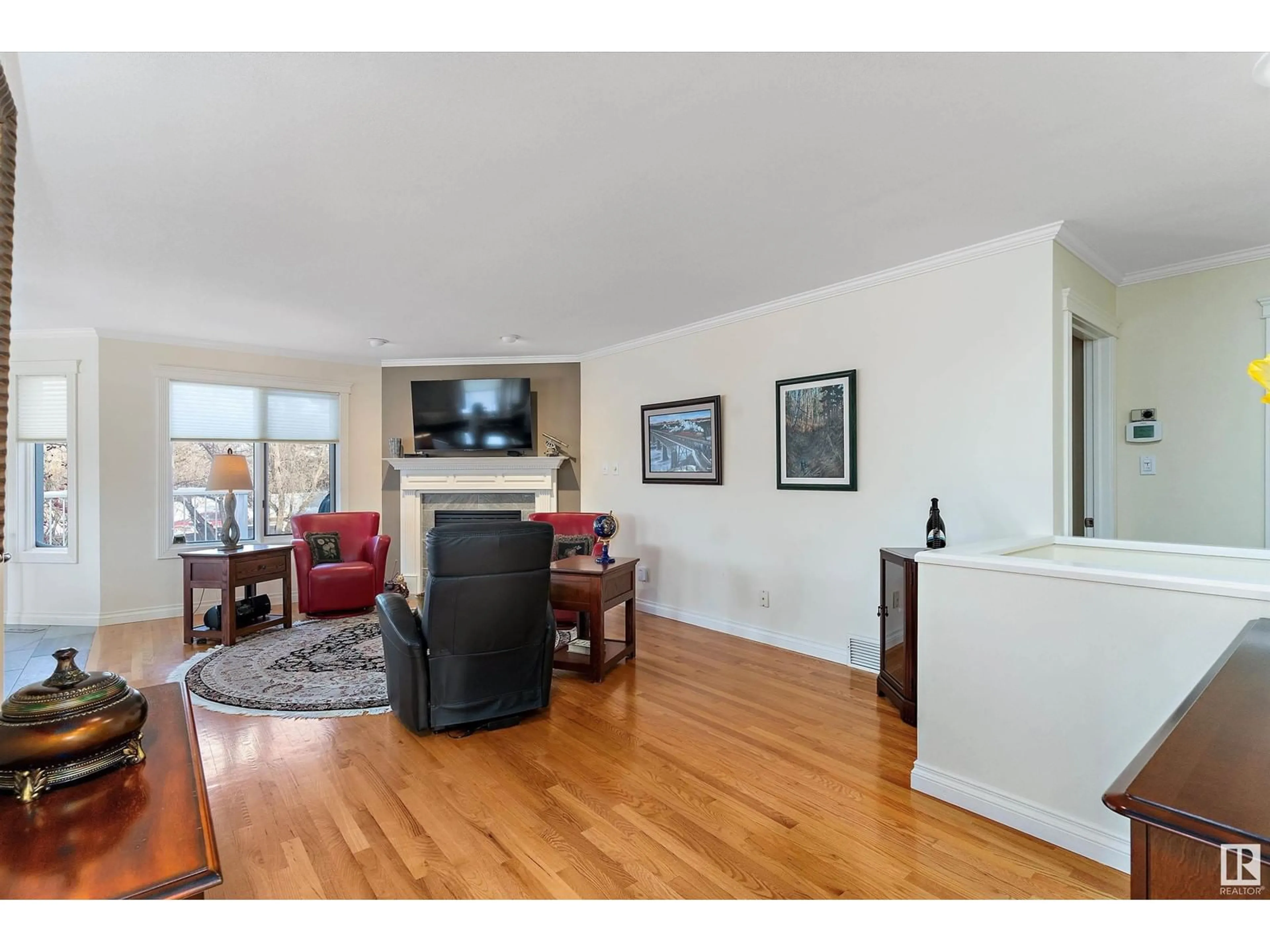 Living room with furniture, wood/laminate floor for 1003 CARTER CREST RD NW, Edmonton Alberta T6R2K1