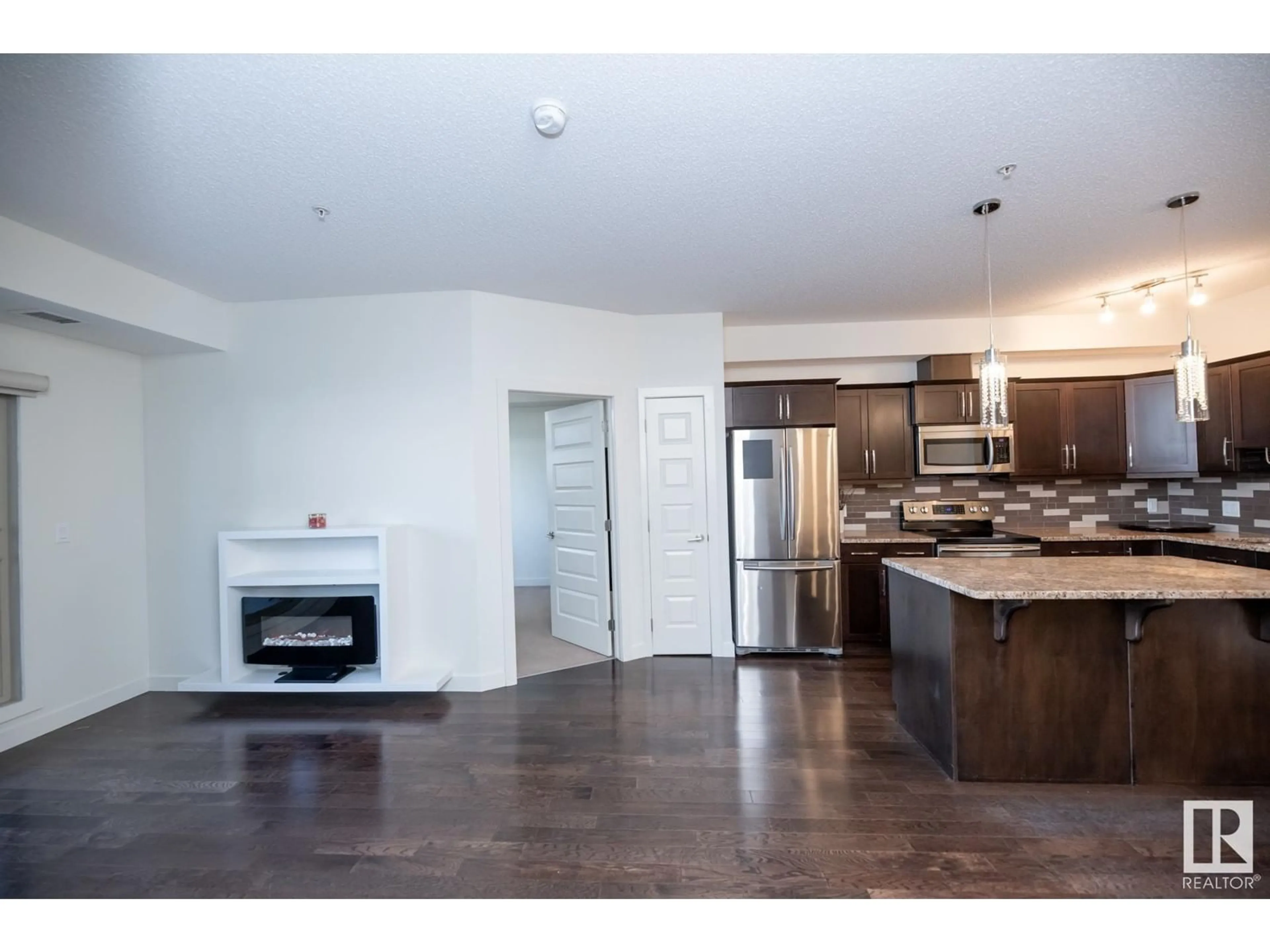 Open concept kitchen, unknown for #105 10520 56 AV NW, Edmonton Alberta T6H0X7