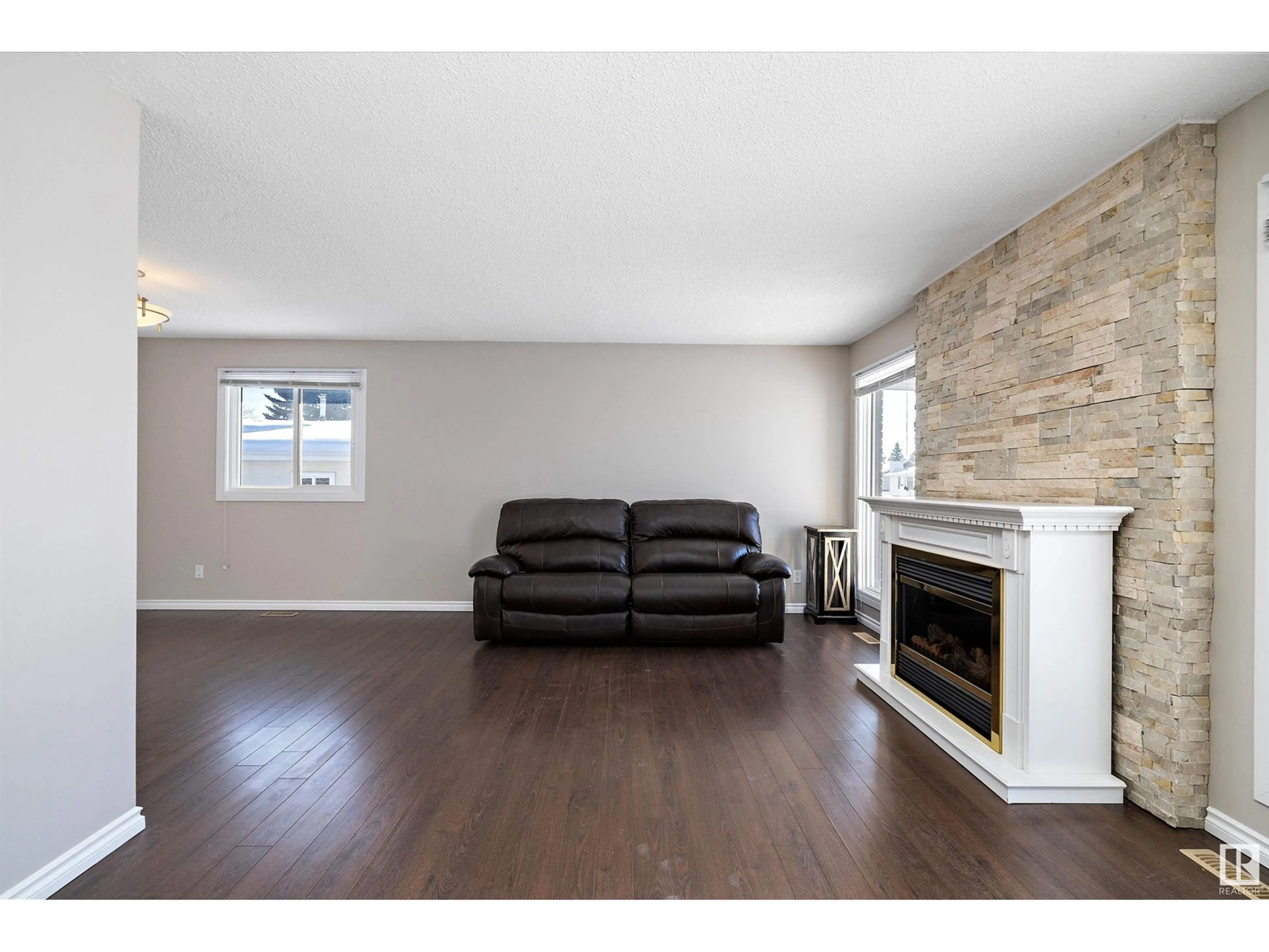 Living room with furniture, wood/laminate floor for 14923 123 ST NW, Edmonton Alberta T5X2C8