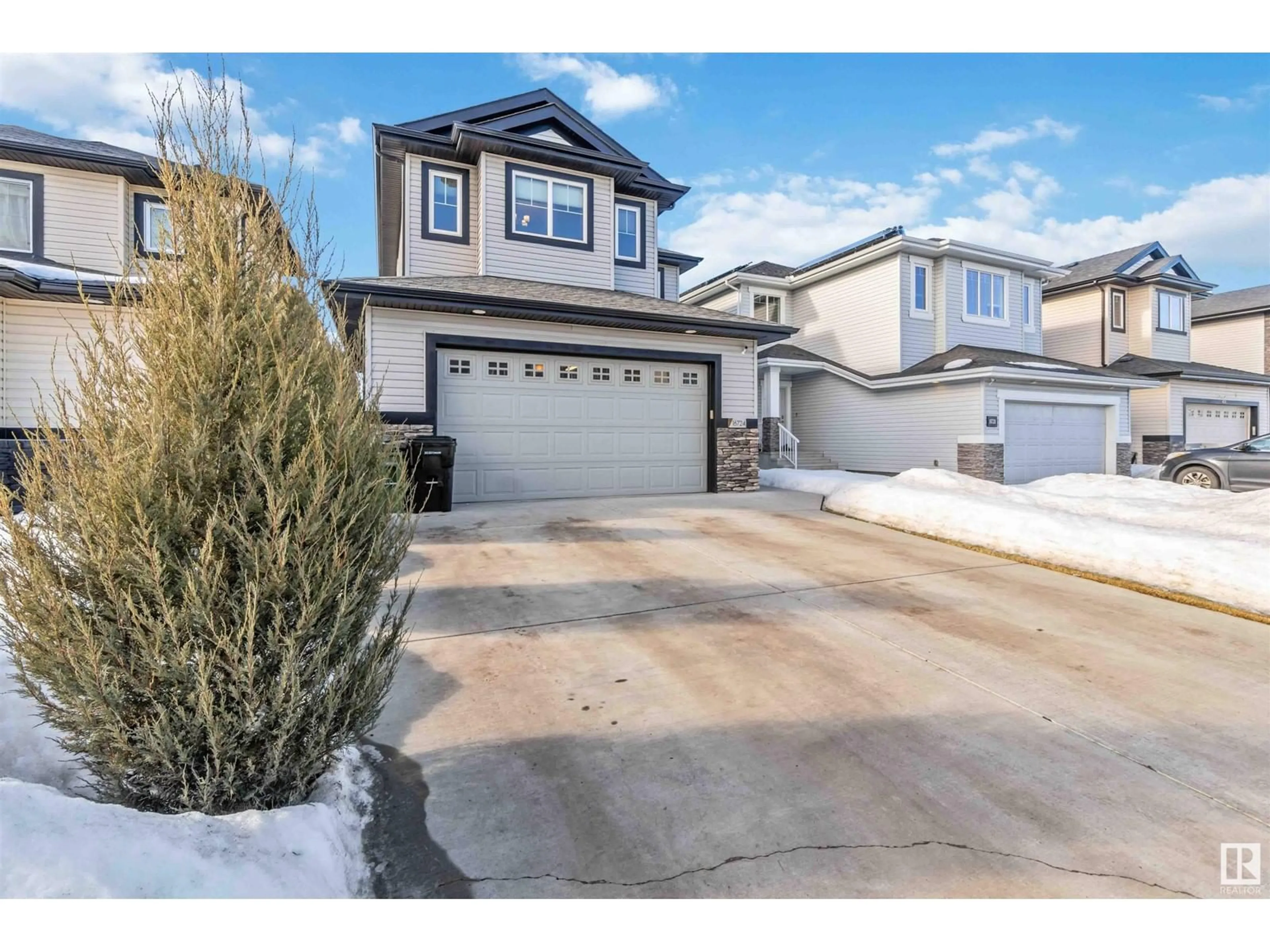 Home with vinyl exterior material, street for 16724 60 ST NW, Edmonton Alberta T5Y0W6