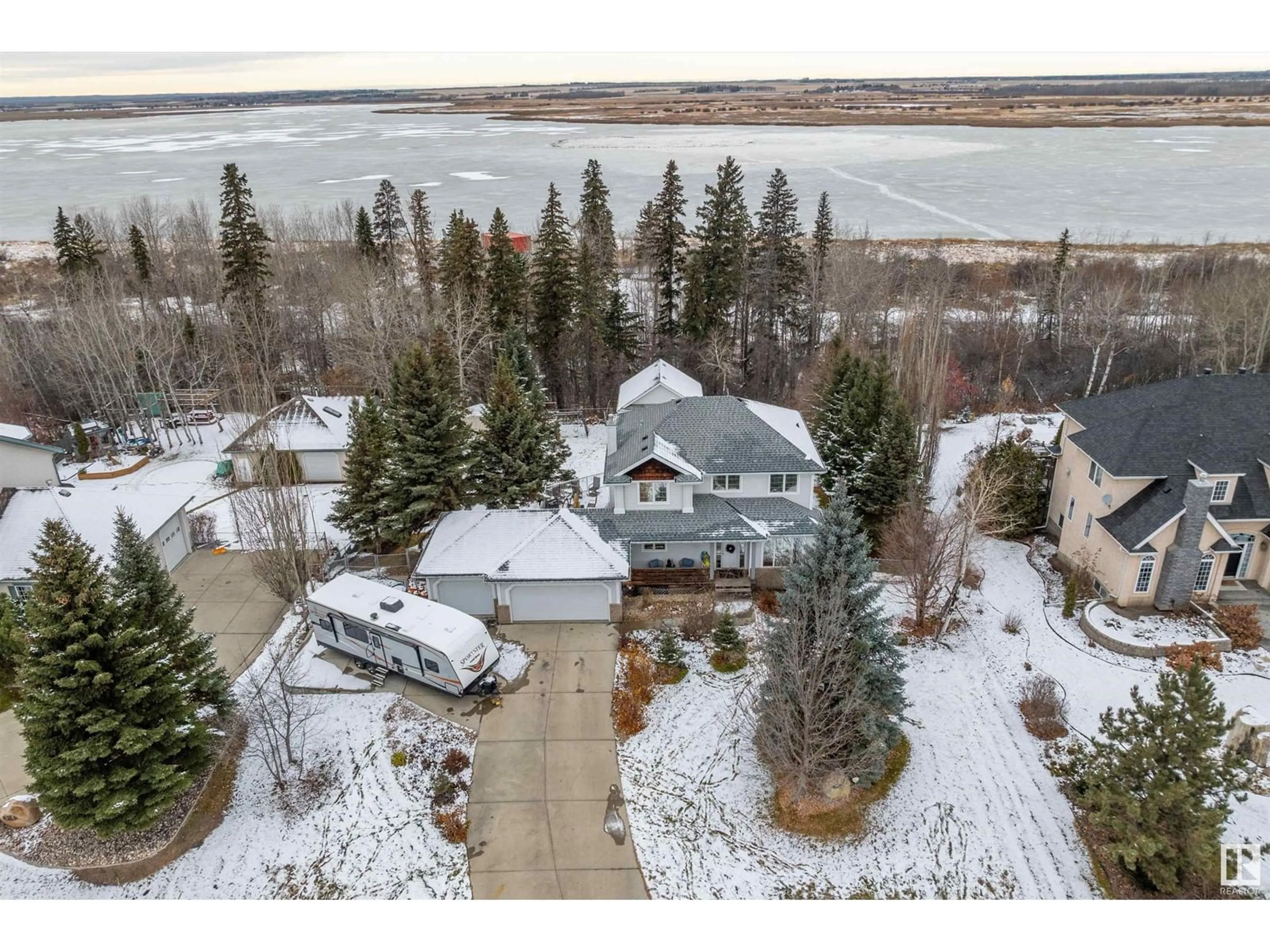 A pic from outside/outdoor area/front of a property/back of a property/a pic from drone, water/lake/river/ocean view for #67 53302 RGE ROAD 261, Rural Parkland County Alberta T7Y1A7