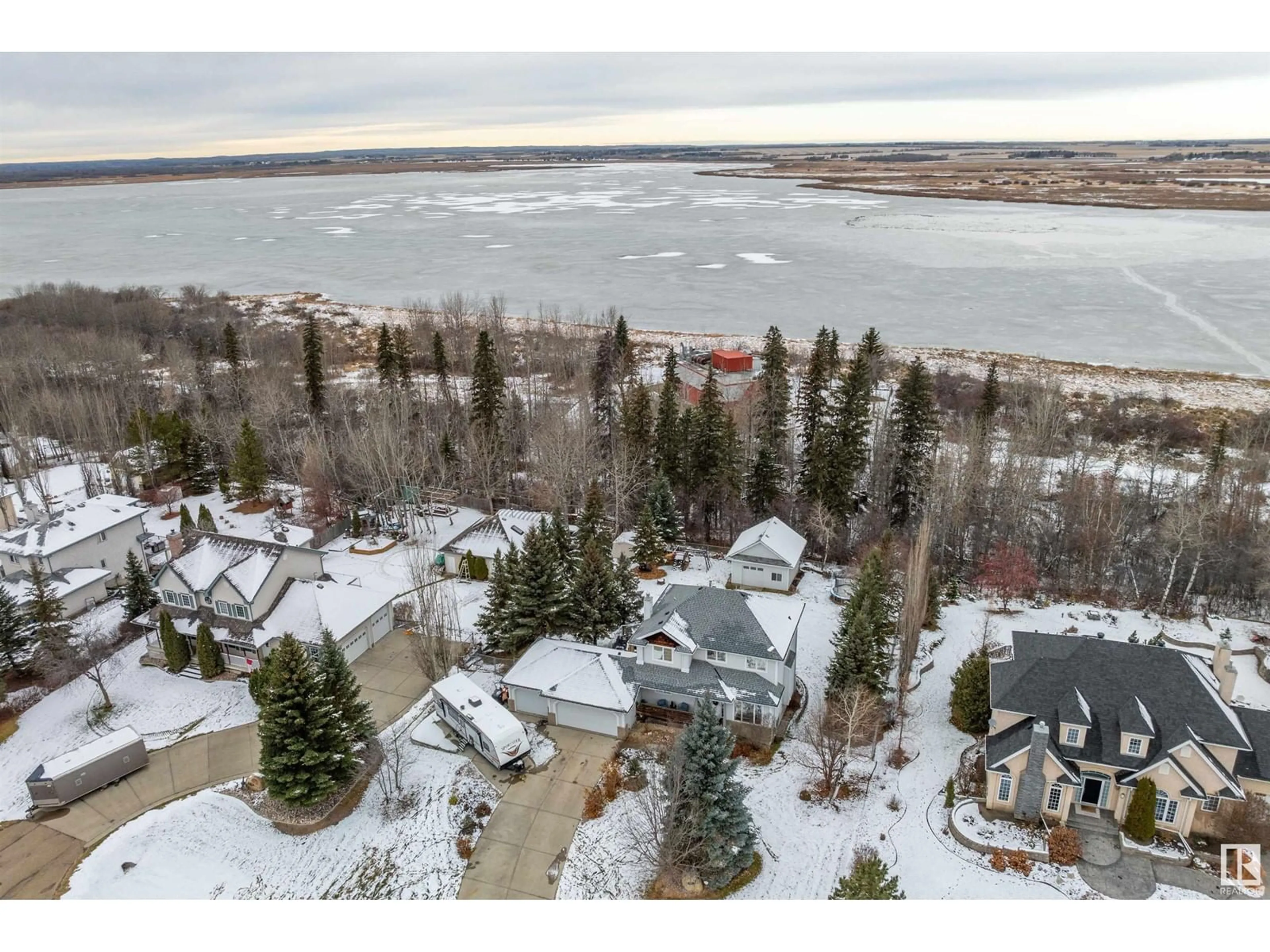 A pic from outside/outdoor area/front of a property/back of a property/a pic from drone, water/lake/river/ocean view for #67 53302 RGE ROAD 261, Rural Parkland County Alberta T7Y1A7