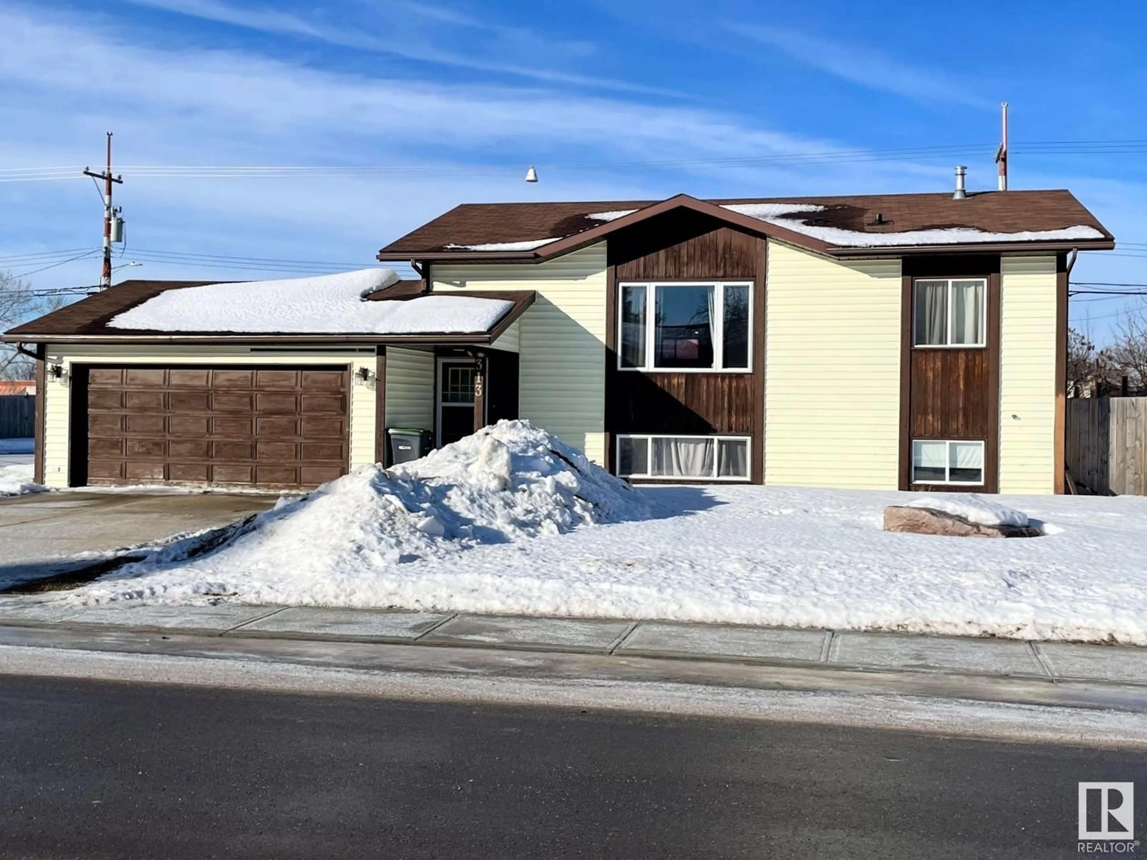 Home with vinyl exterior material, street for 313 22 ST, Cold Lake Alberta T9M1E8