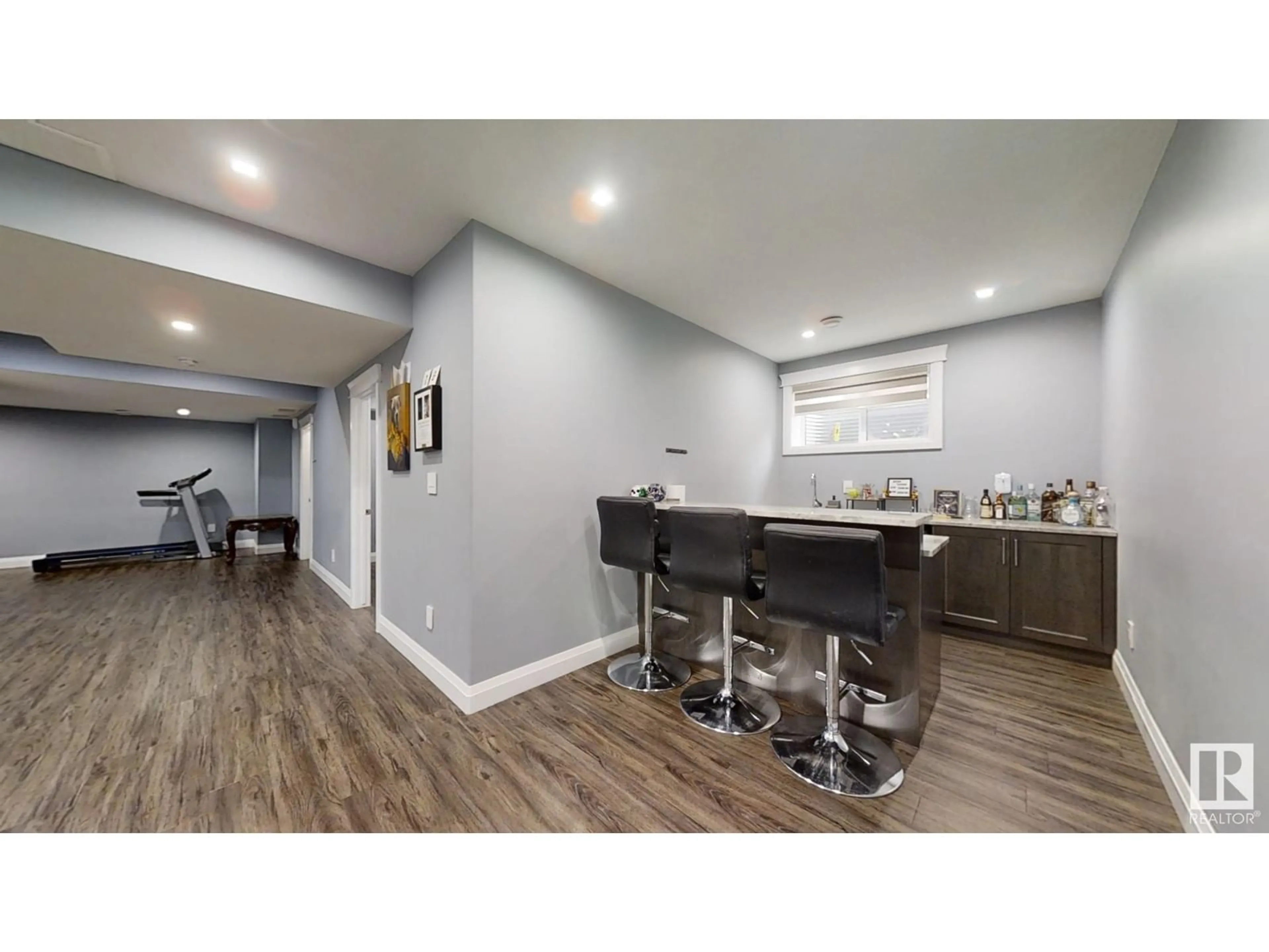 Open concept kitchen, wood/laminate floor for 1966 Adamson TC SW, Edmonton Alberta T6W1A8